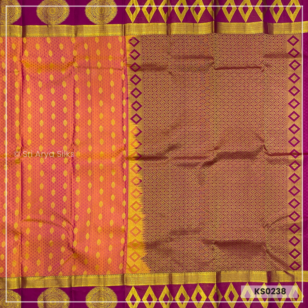 Dual Tone Orange Brocade Silk Saree With Magenta Pink Blouse & Embossed Pattern