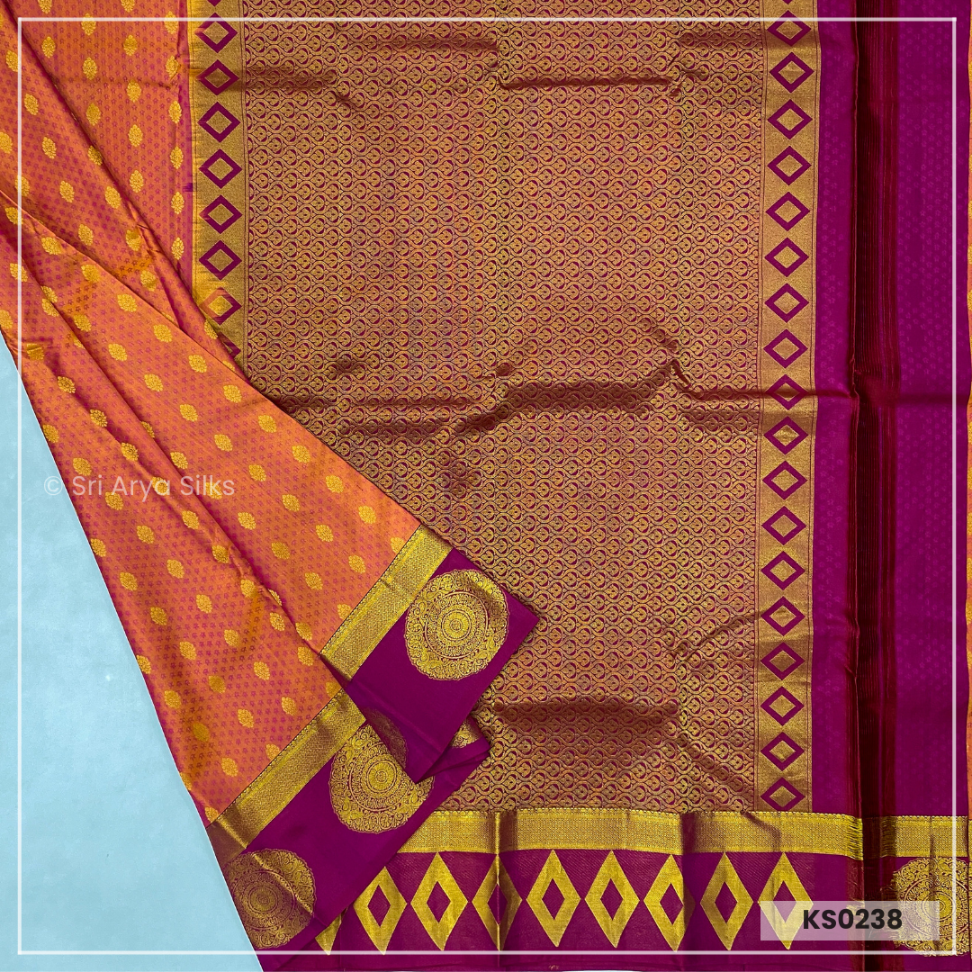 Dual Tone Orange Brocade Silk Saree With Magenta Pink Blouse & Embossed Pattern