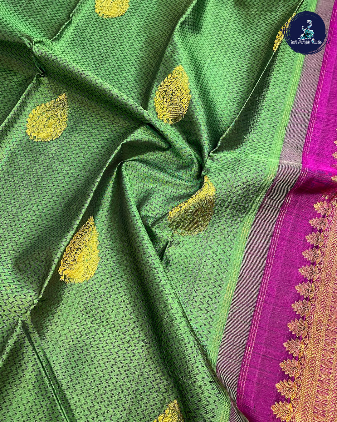 Green Traditional Silk Saree With Purple Blouse & Buttas Pattern