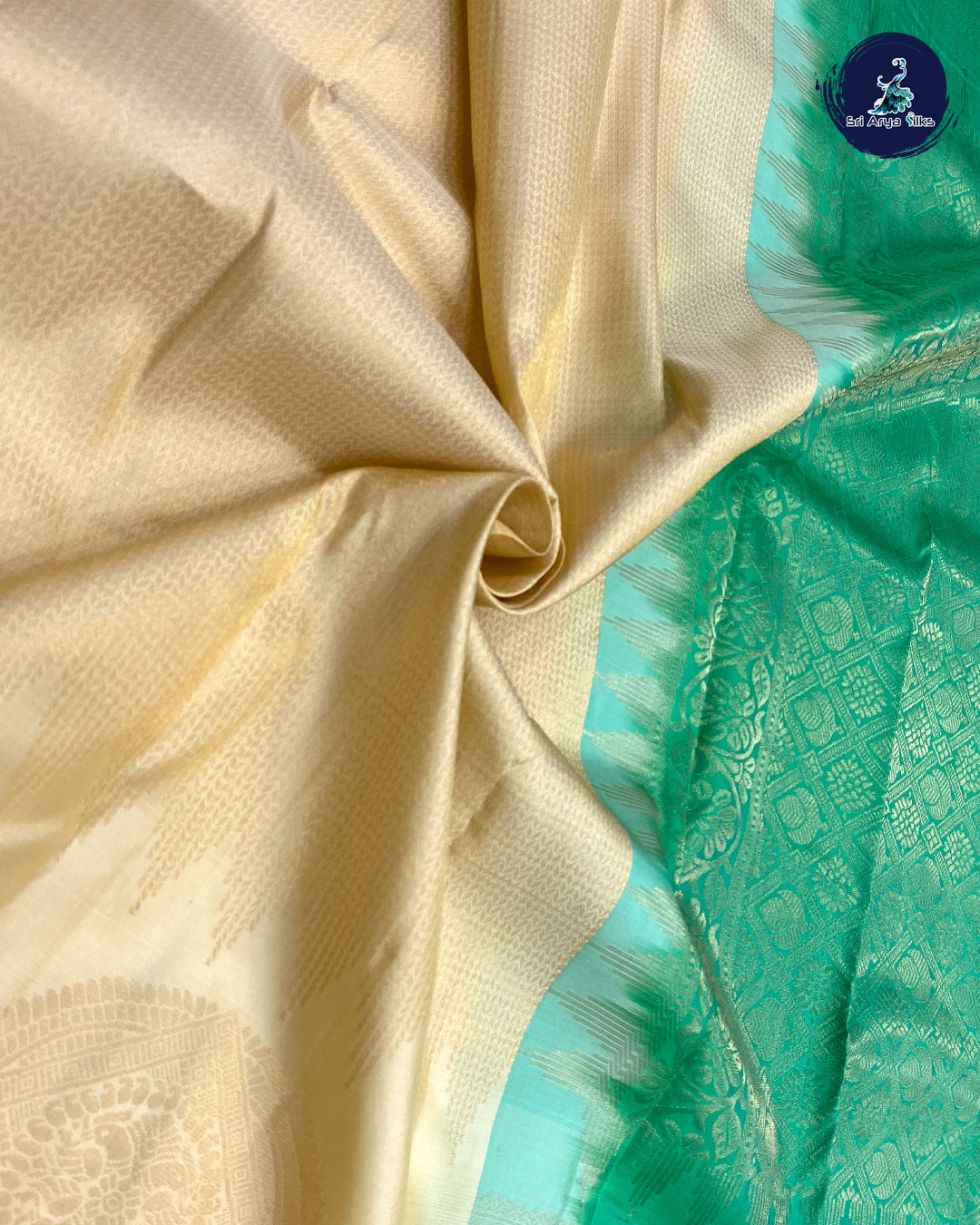 White And Green Brocade Silk Saree With Green Blouse & Buttas Pattern