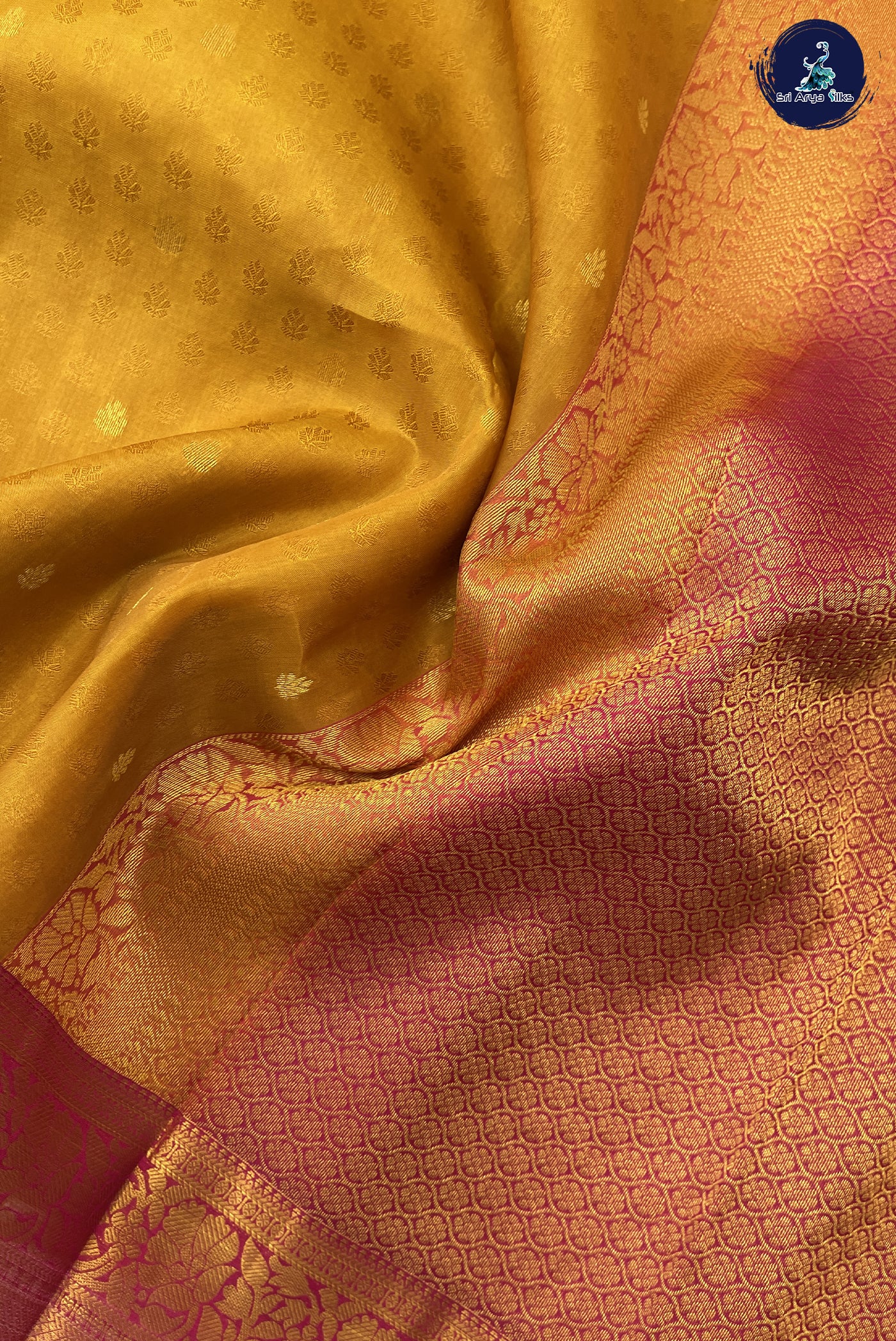 Mustard Yellow Embosed Saree With Pink Blouse & Buttas Pattern