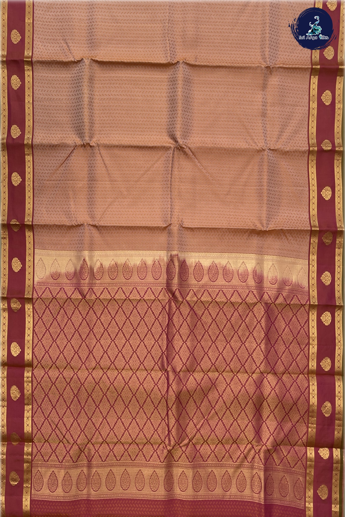 Chikku Shade Bridal Silk Saree With Embossed Pattern