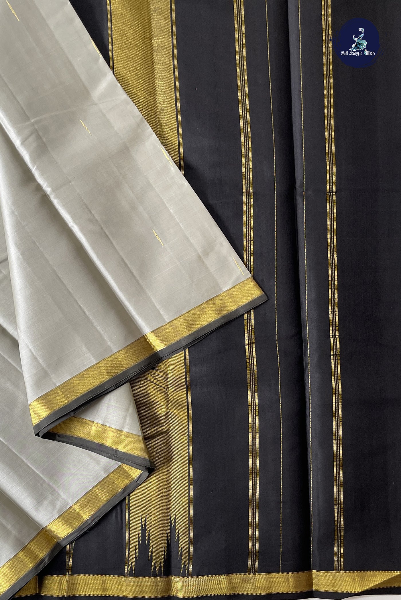 Silver Grey Light Weight Silk Saree With Zari Buttas Pattern