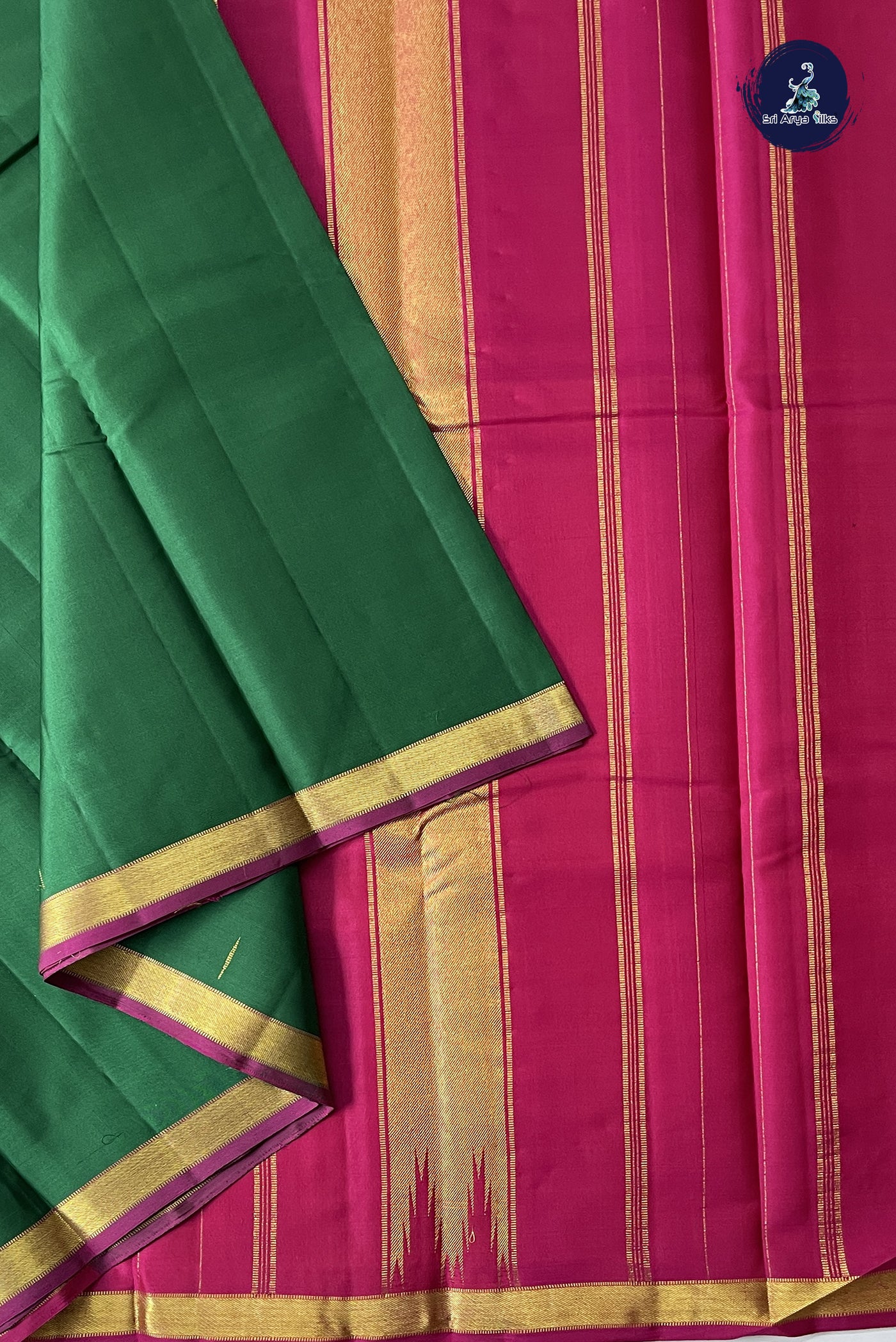 Dark Green Light Weight Silk Saree With Zari Buttas Pattern