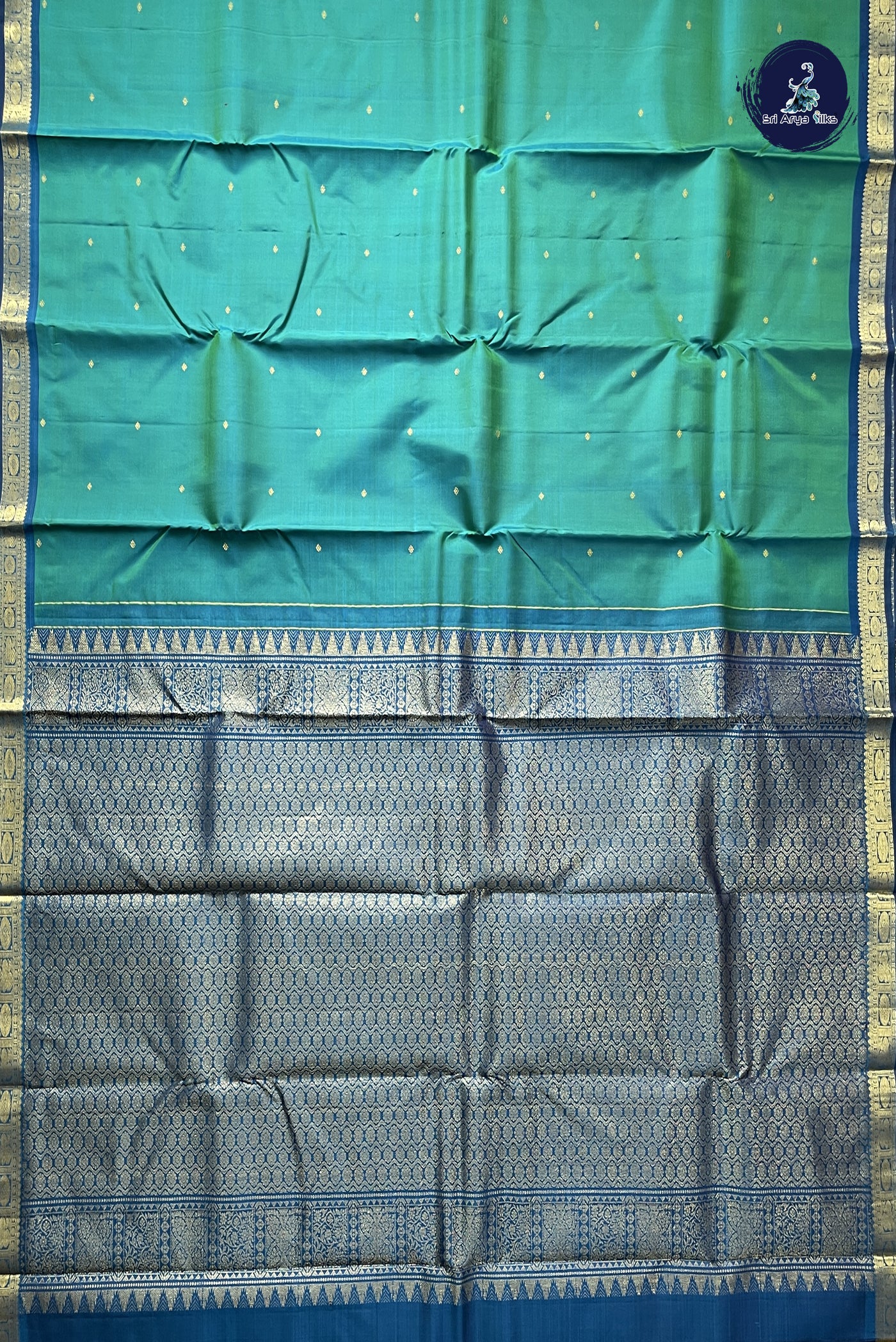 Bluish Green Light Weight Silk Saree With Zari Buttas Pattern