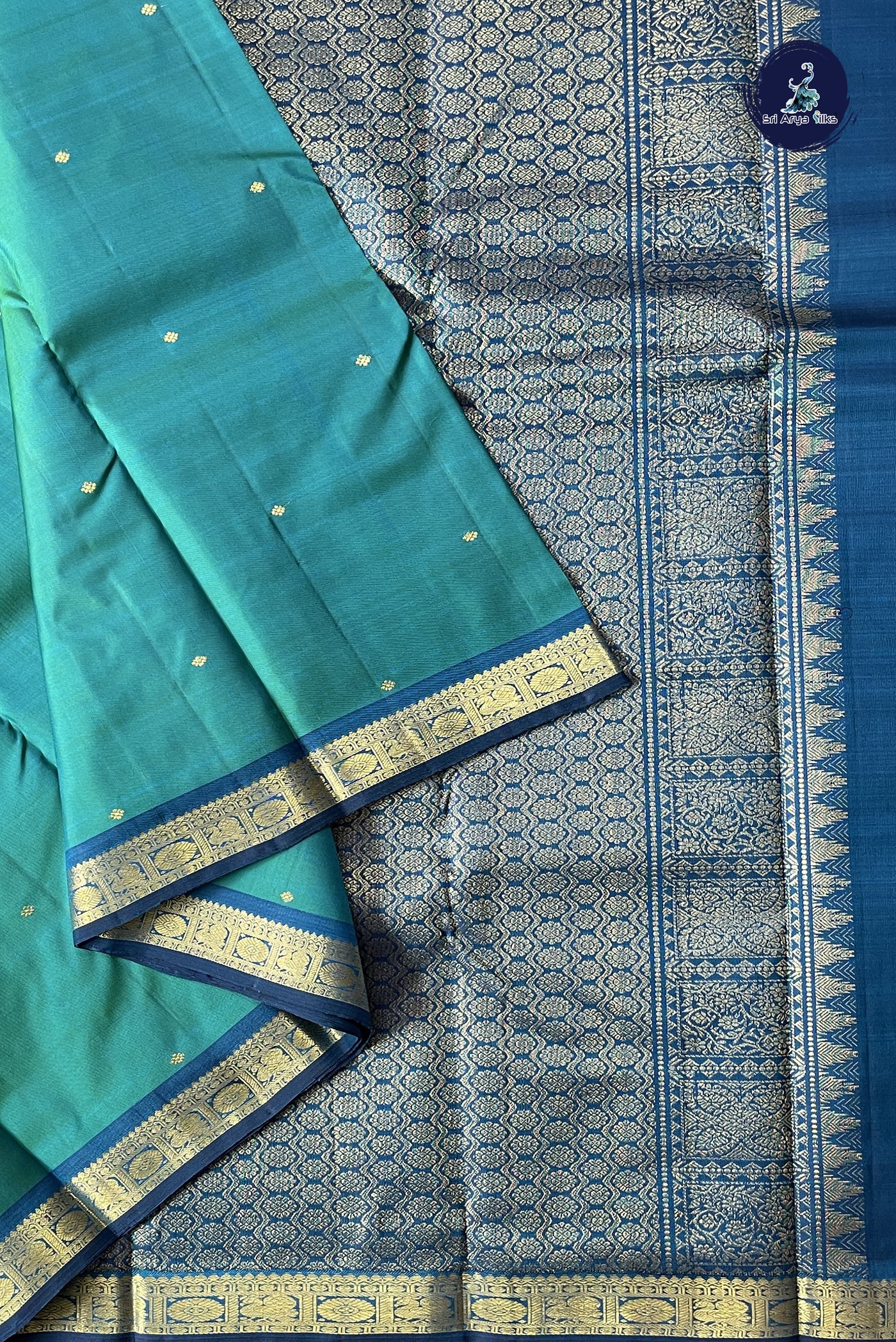 Bluish Green Light Weight Silk Saree With Zari Buttas Pattern