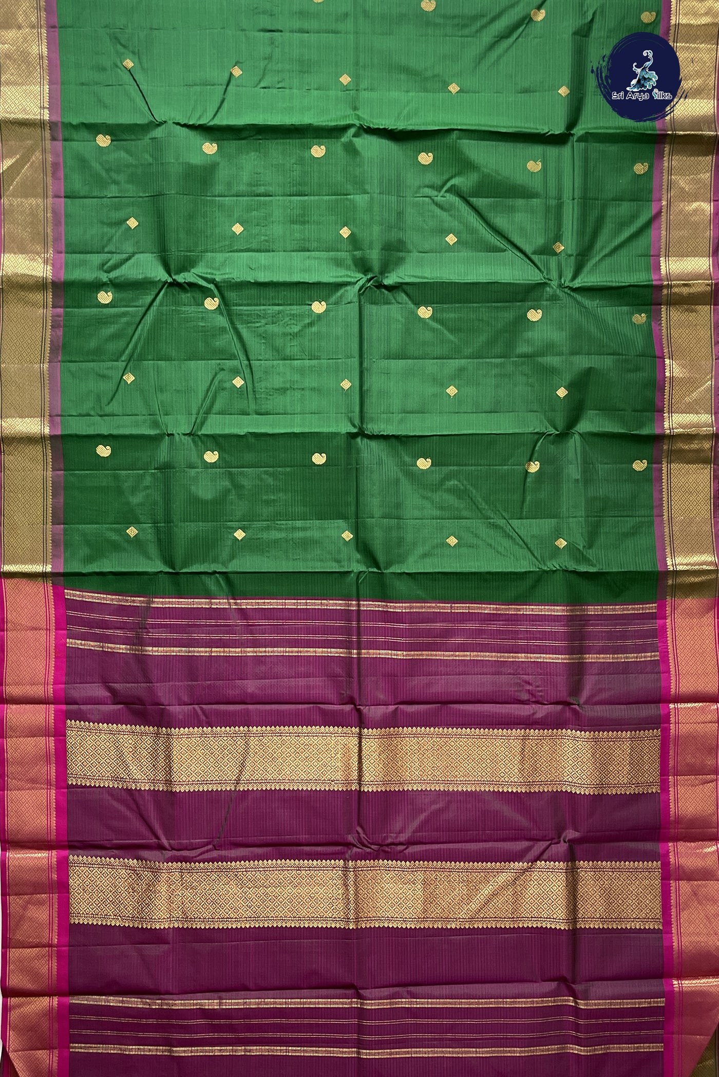 Bottle Green Light Weight Silk Saree With Zari Buttas Pattern