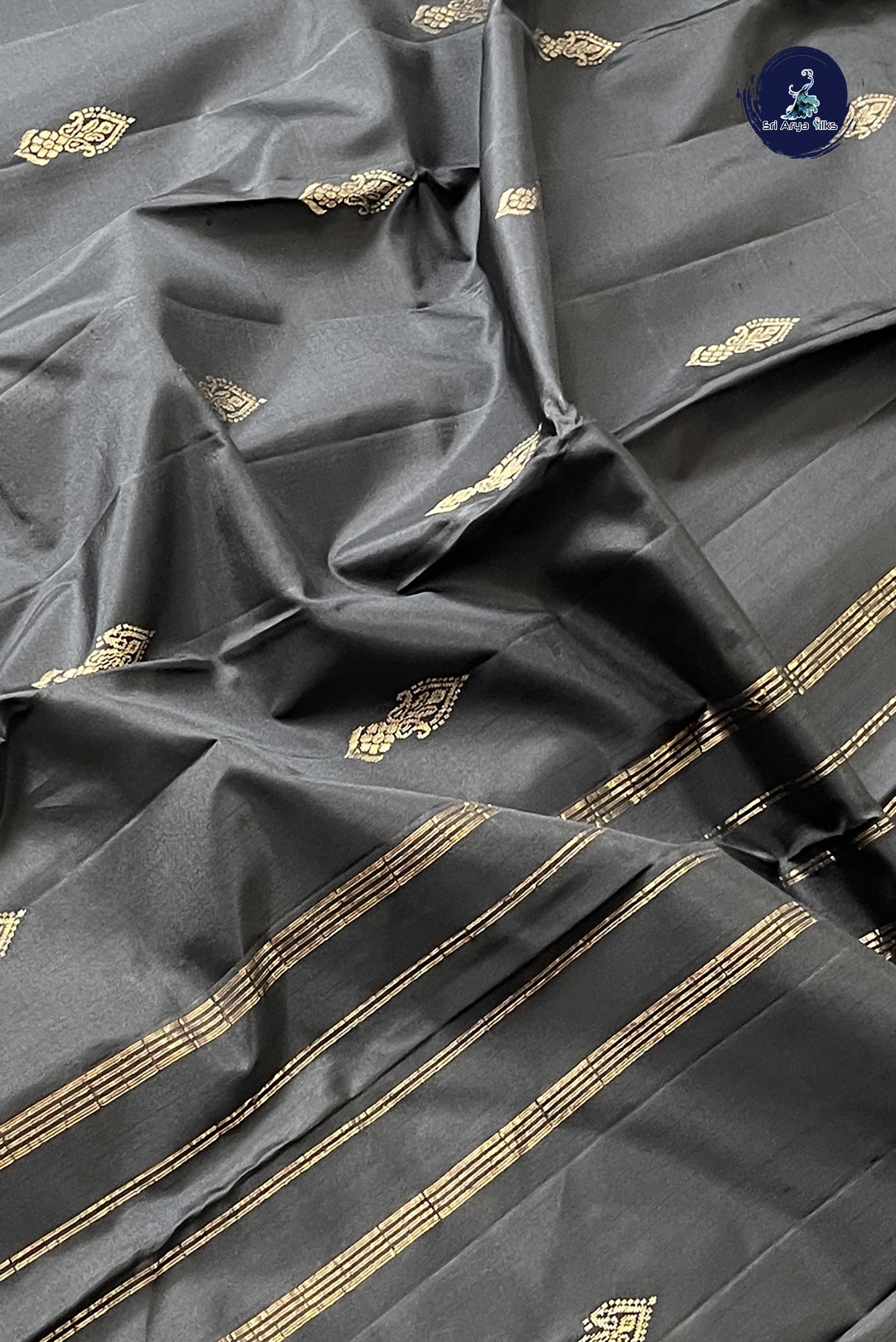 Black Light Weight Silk Saree With Zari Buttas Pattern