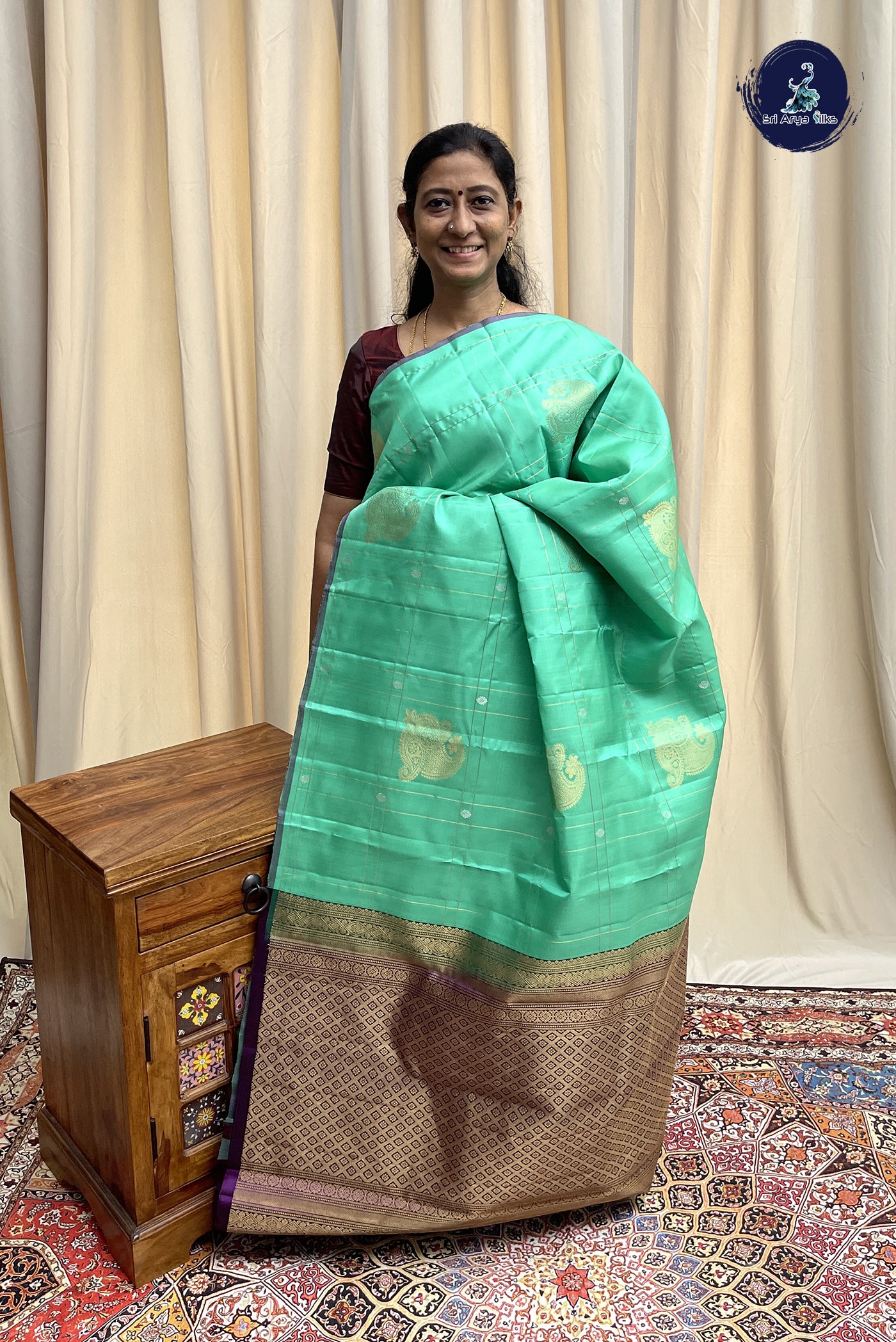Sea Green Soft Silk Saree With Zari Checked Pattern
