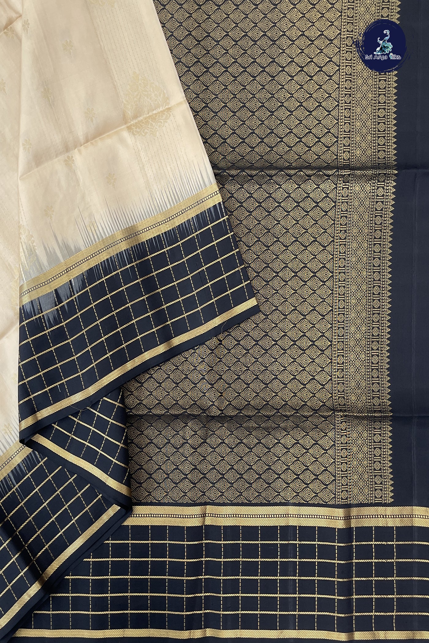 Cream Soft Silk Saree With Zari Buttas Pattern