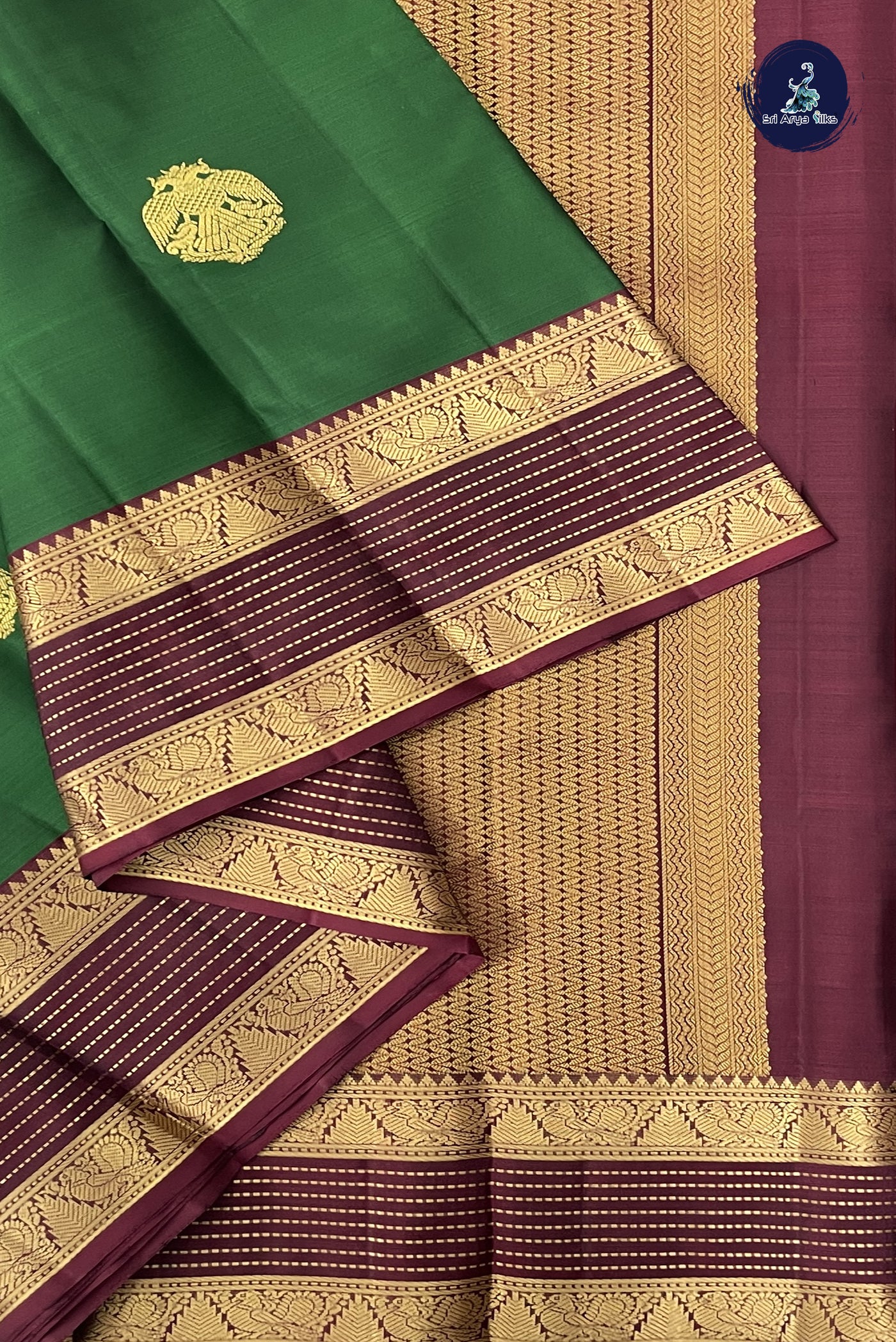 Dark Green Traditional Silk Saree With Zari Buttas Pattern