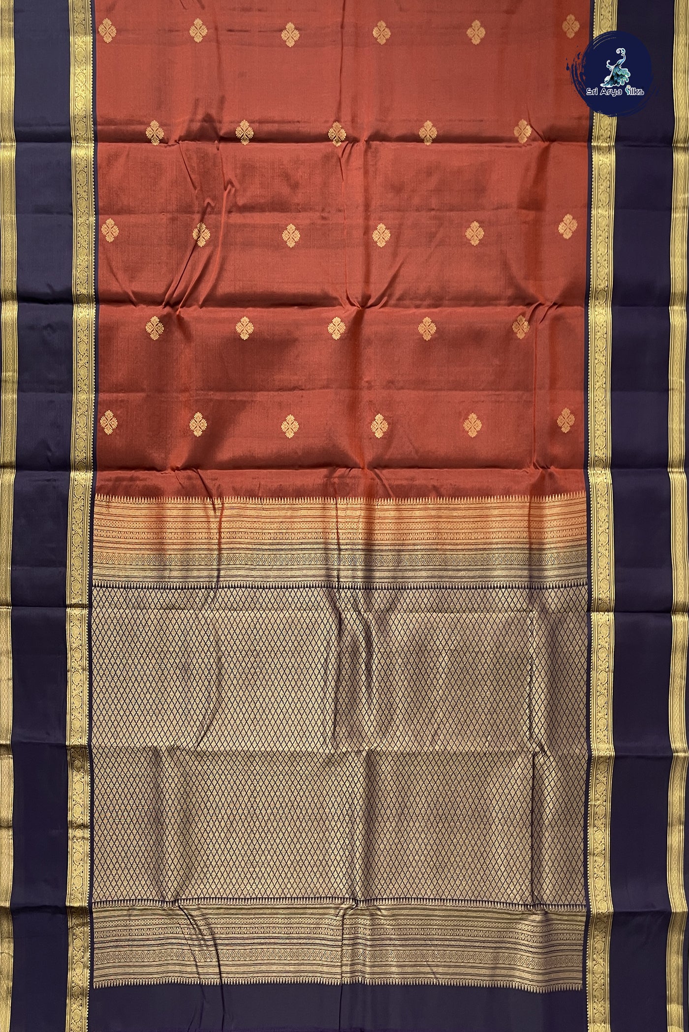 Rust Traditional Silk Saree With Zari Buttas Pattern