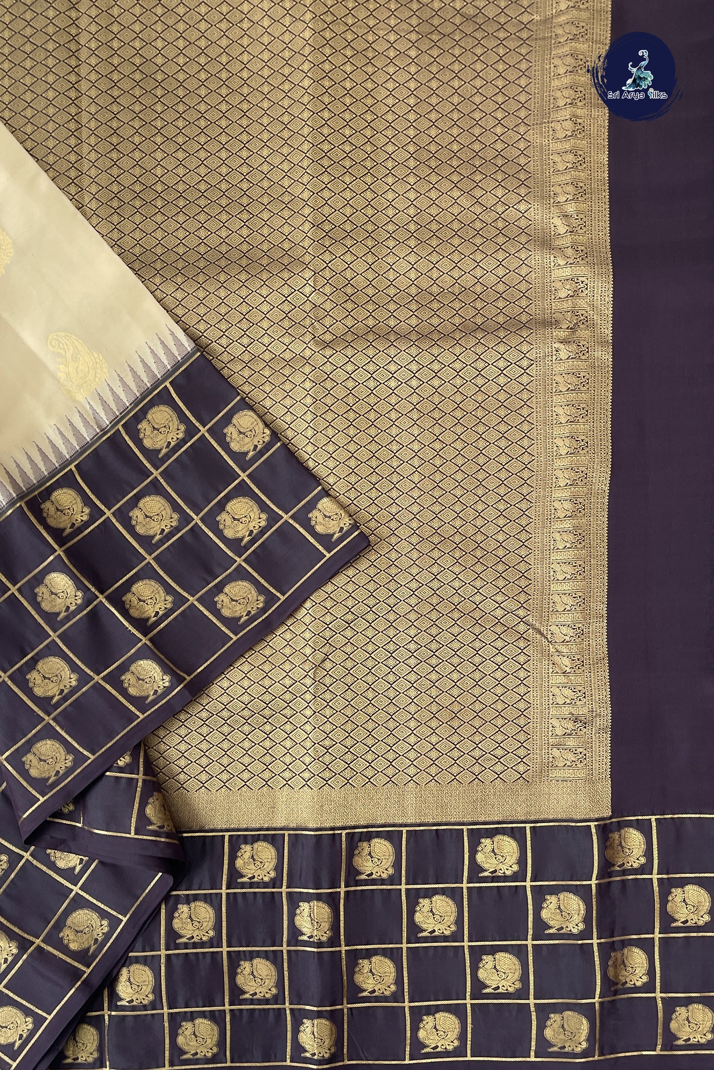 Ivory Half Pure Silk Saree With Zari Buttas Pattern