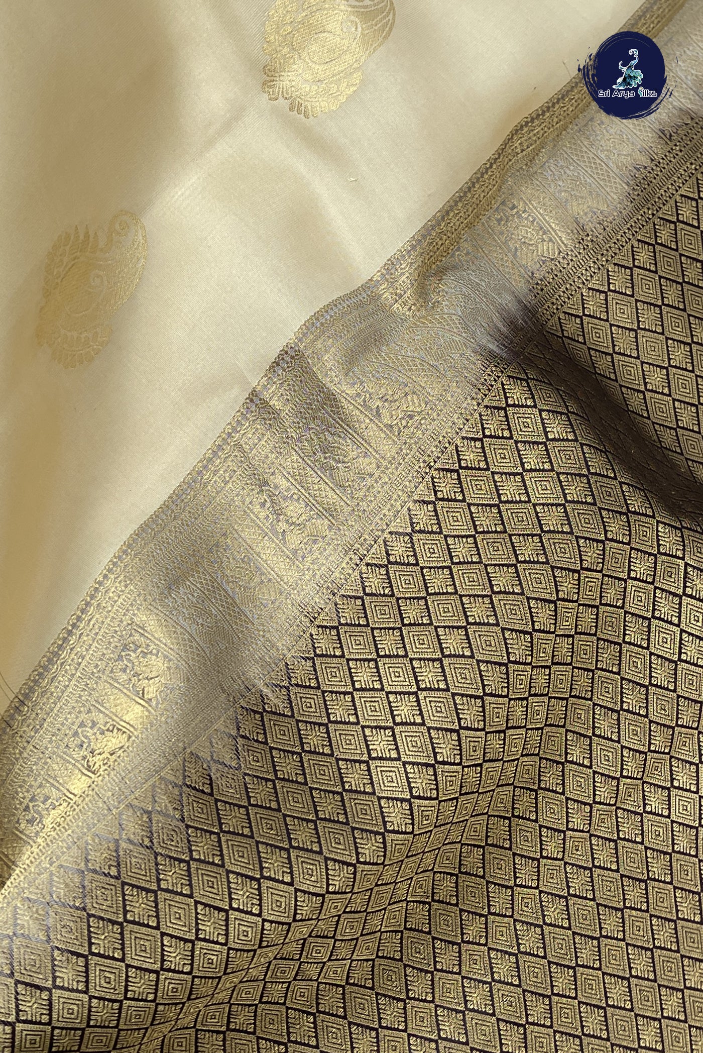 Ivory Half Pure Silk Saree With Zari Buttas Pattern