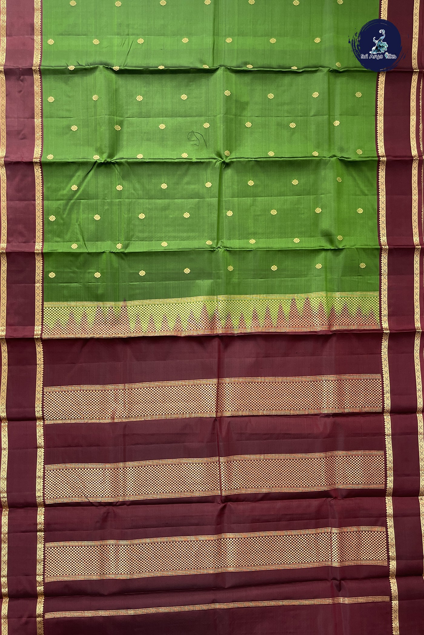 Green Light Weight Silk Saree With Zari Buttas Pattern