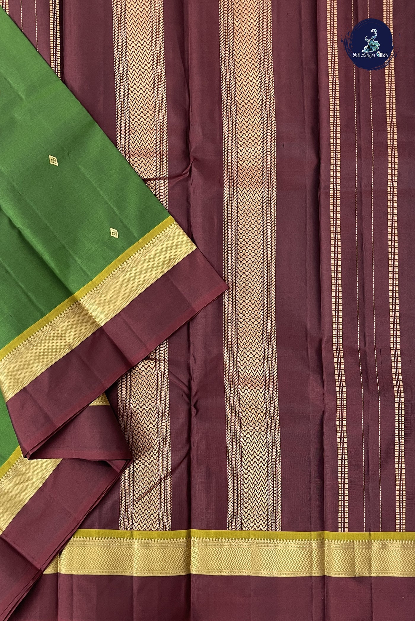 Green Light Weight Silk Saree With Zari Buttas Pattern