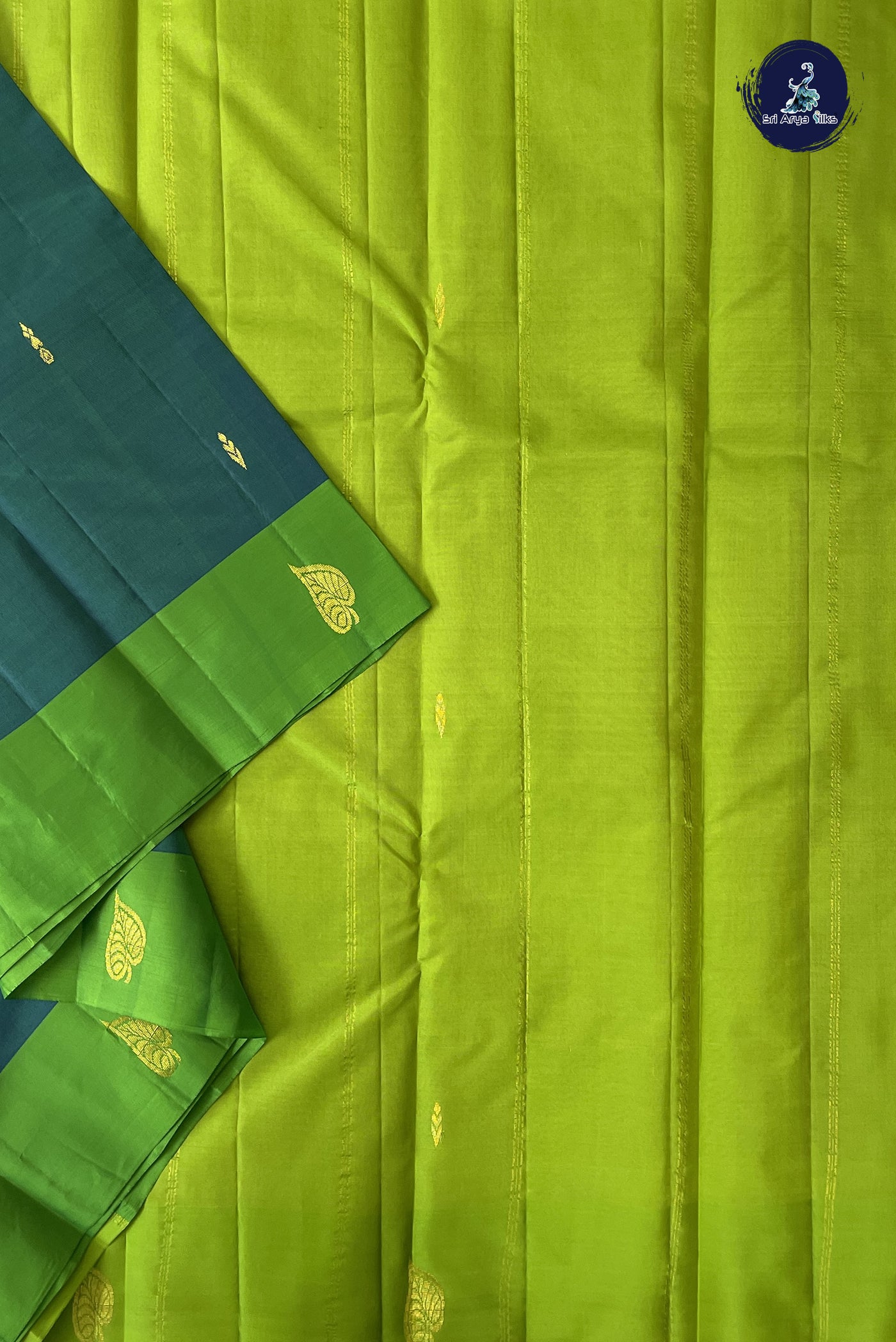 Bluish Green Light Weight Silk Saree With Zari Buttas Pattern