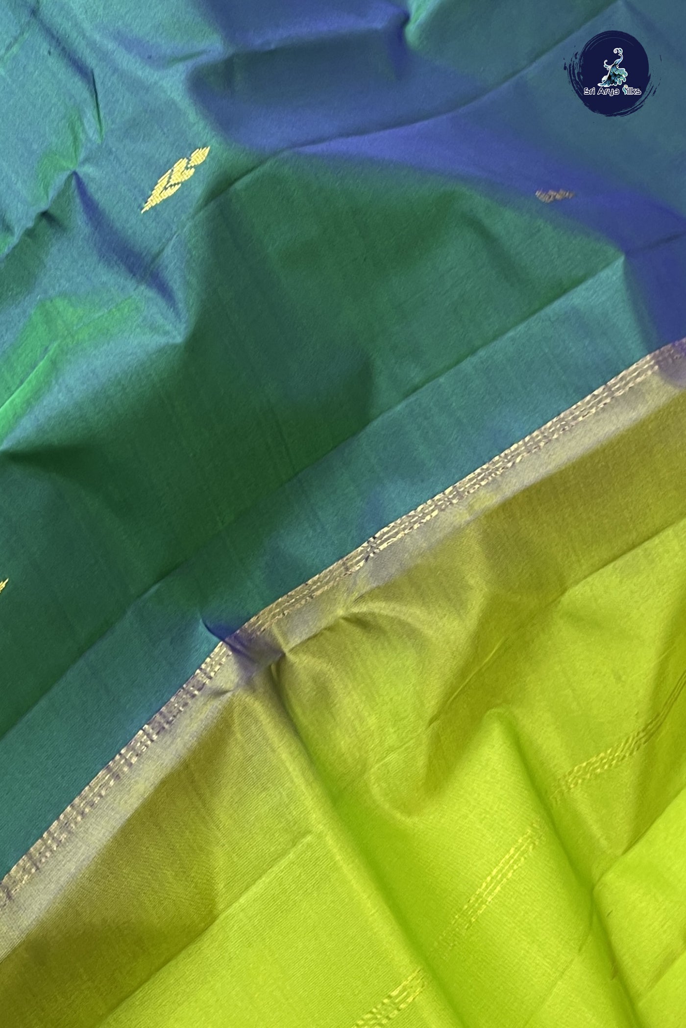 Bluish Green Light Weight Silk Saree With Zari Buttas Pattern