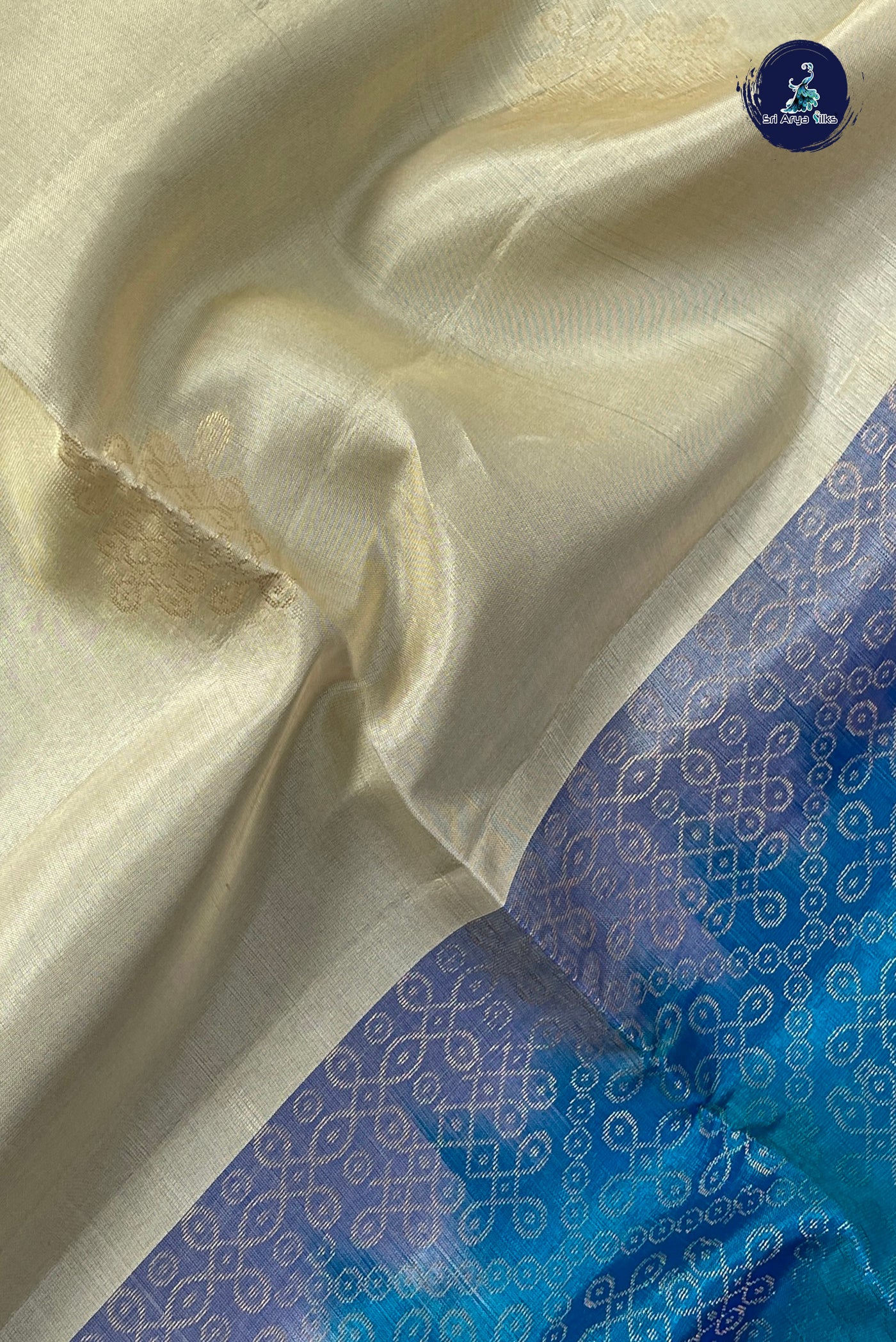Cream Half Pure Silk Saree With Kolam Butta Pattern