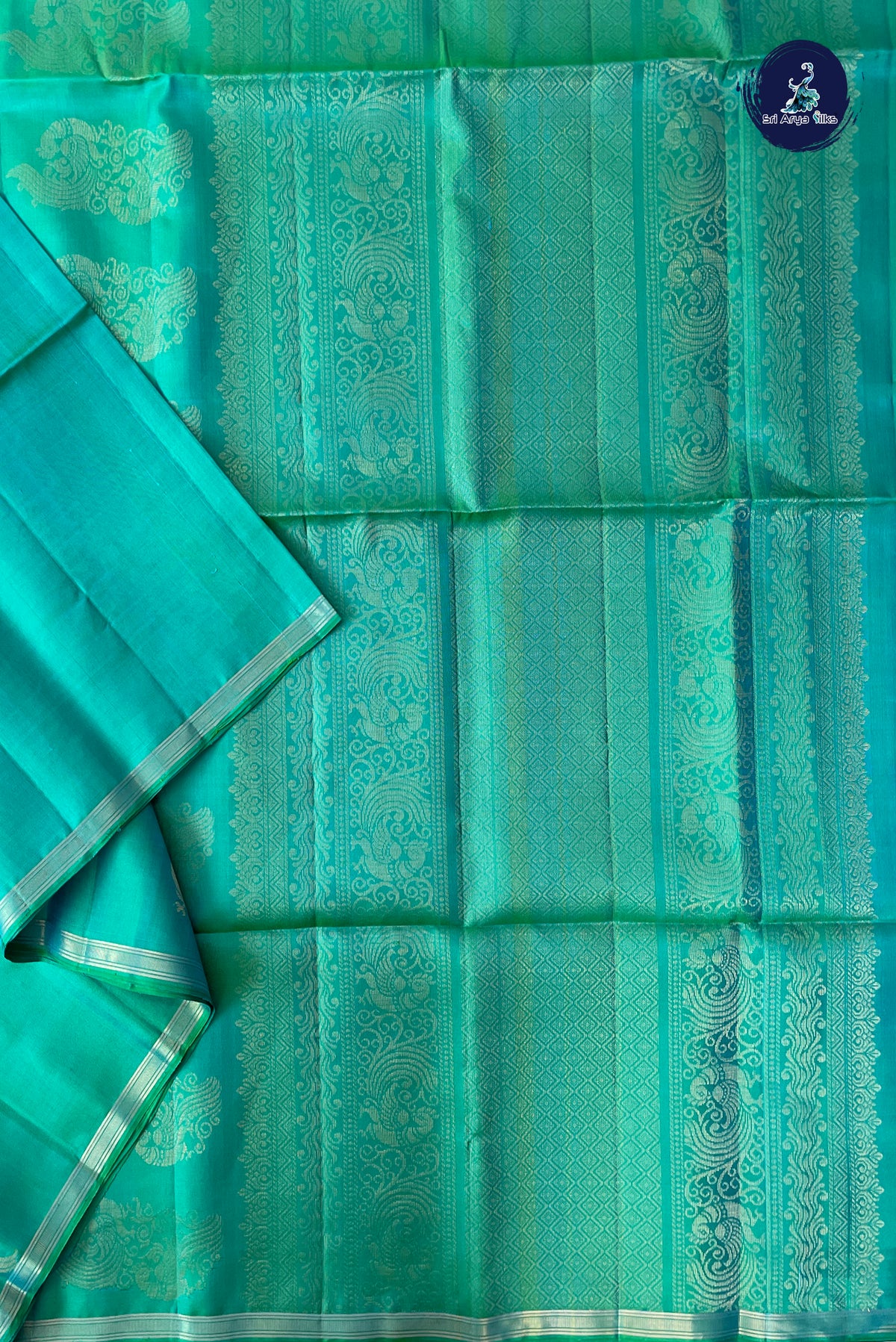 Bluish Green Soft Silk Saree With Peacock Butta Pattern