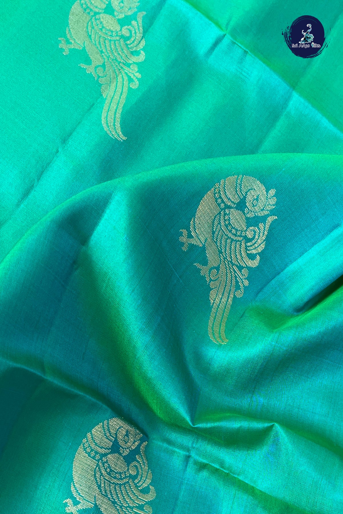 Bluish Green Soft Silk Saree With Peacock Butta Pattern