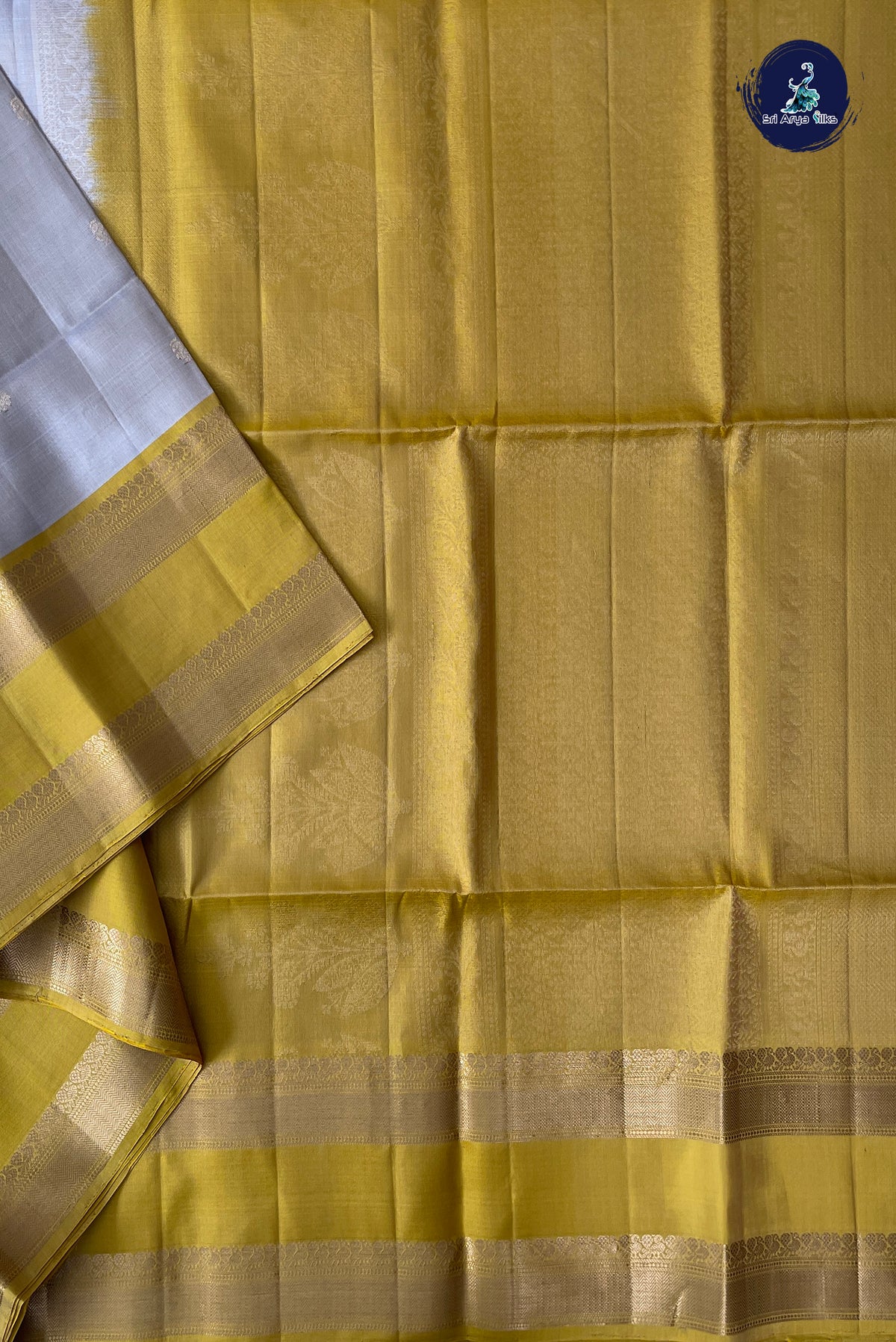 Beige Soft Silk Saree With Zari Buttas Pattern