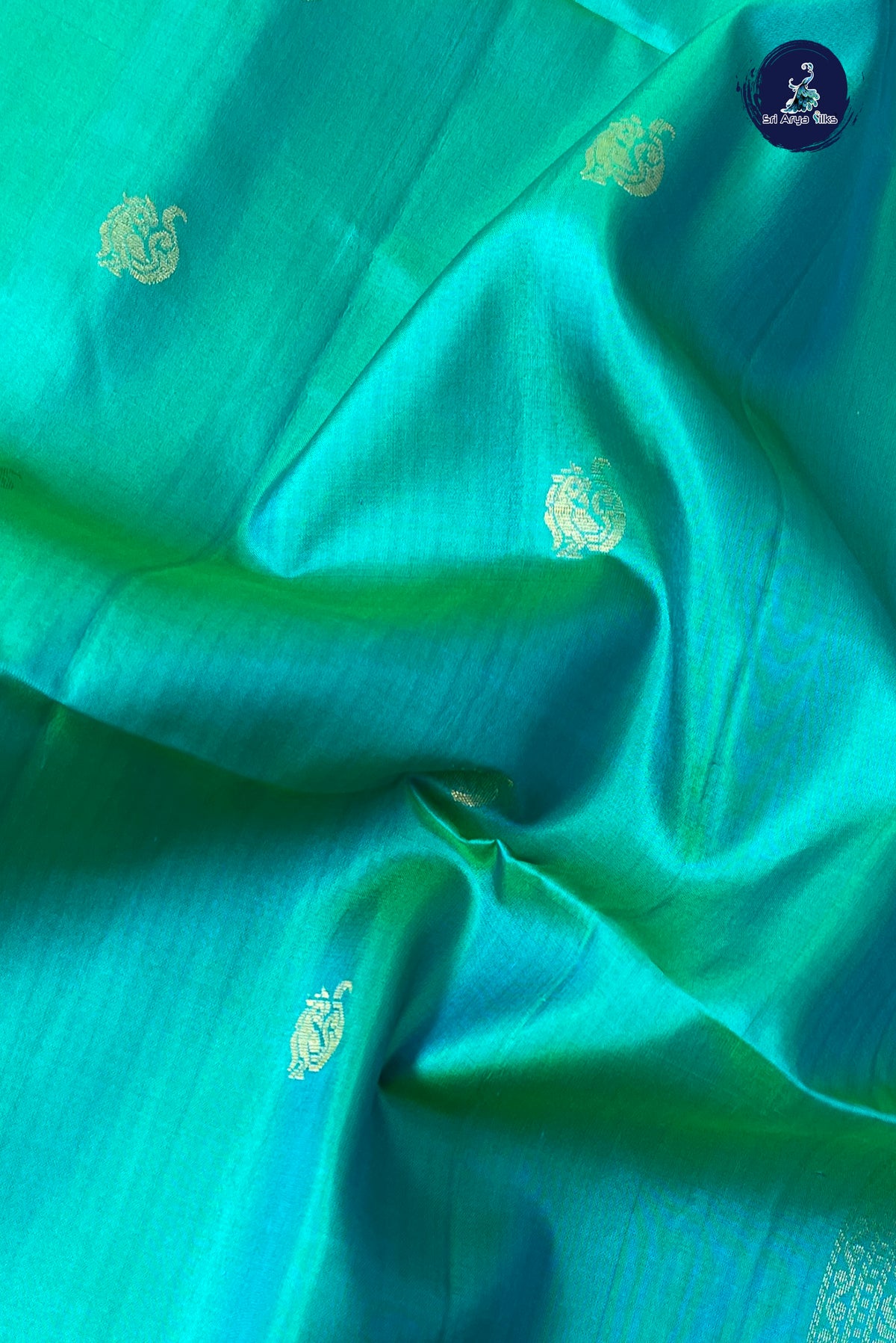 Bluish Green Soft Silk Saree With Zari Buttas Pattern
