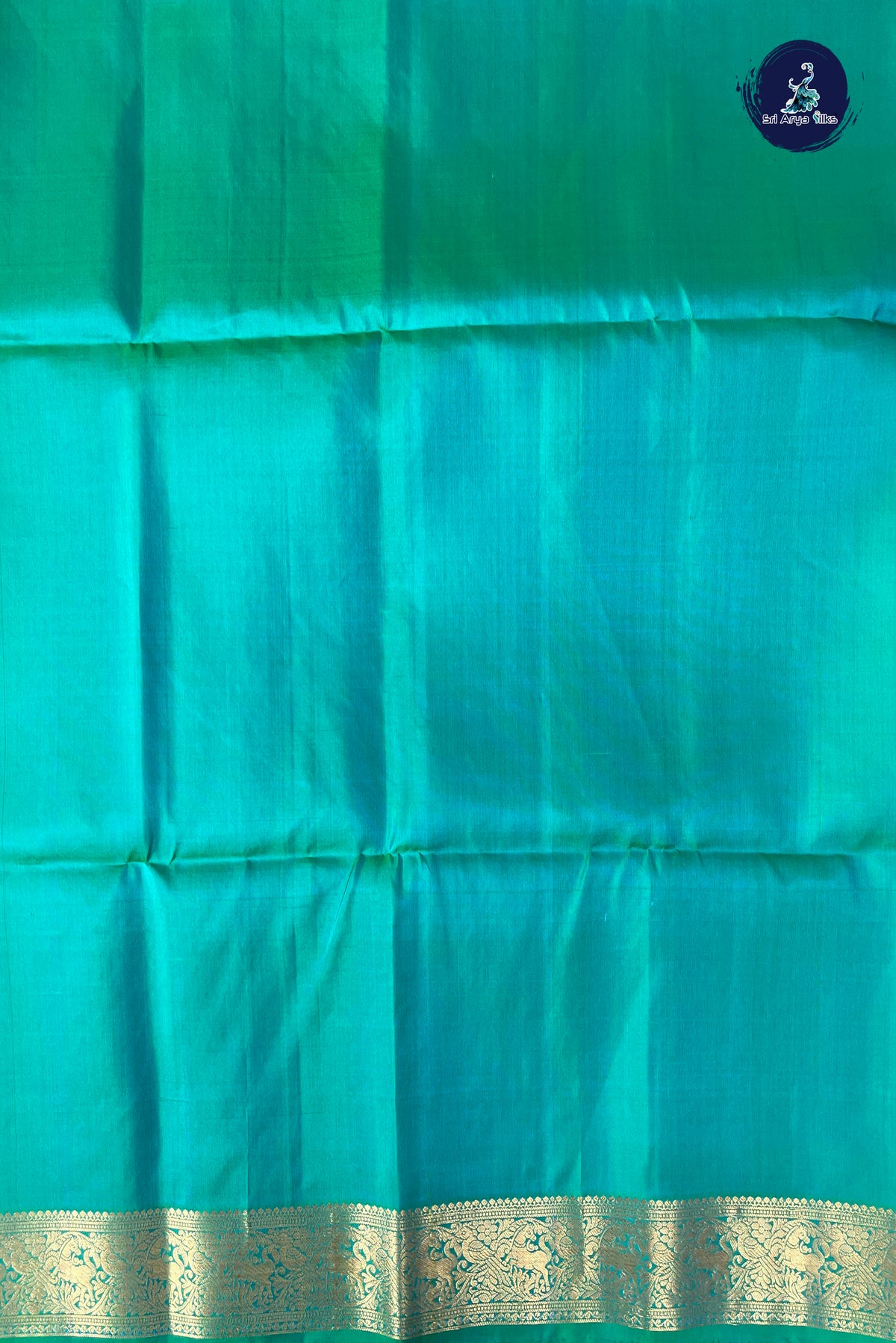 Bluish Green Soft Silk Saree With Zari Buttas Pattern