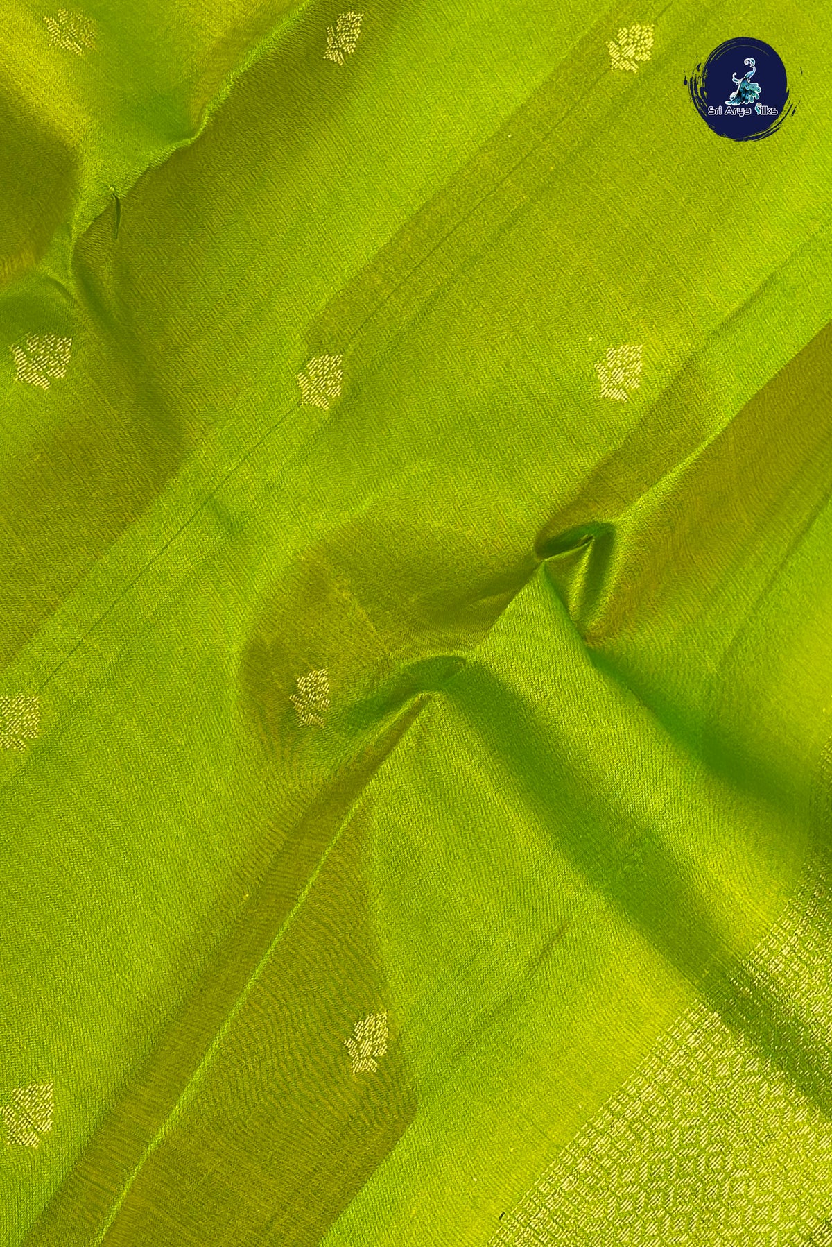 Lime Green Light Weight Silk Saree With Zari Buttas Pattern