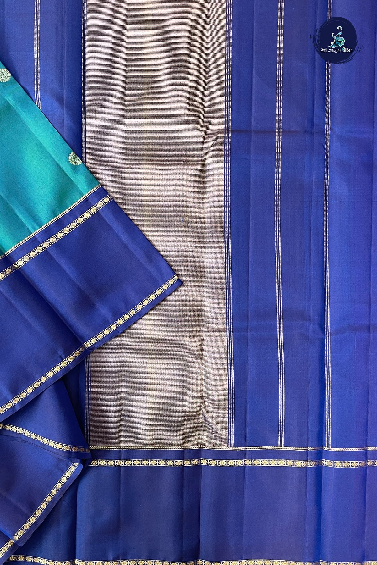 Peacock Blue Rettaippade Border Silk Saree With Zari Buttas Pattern