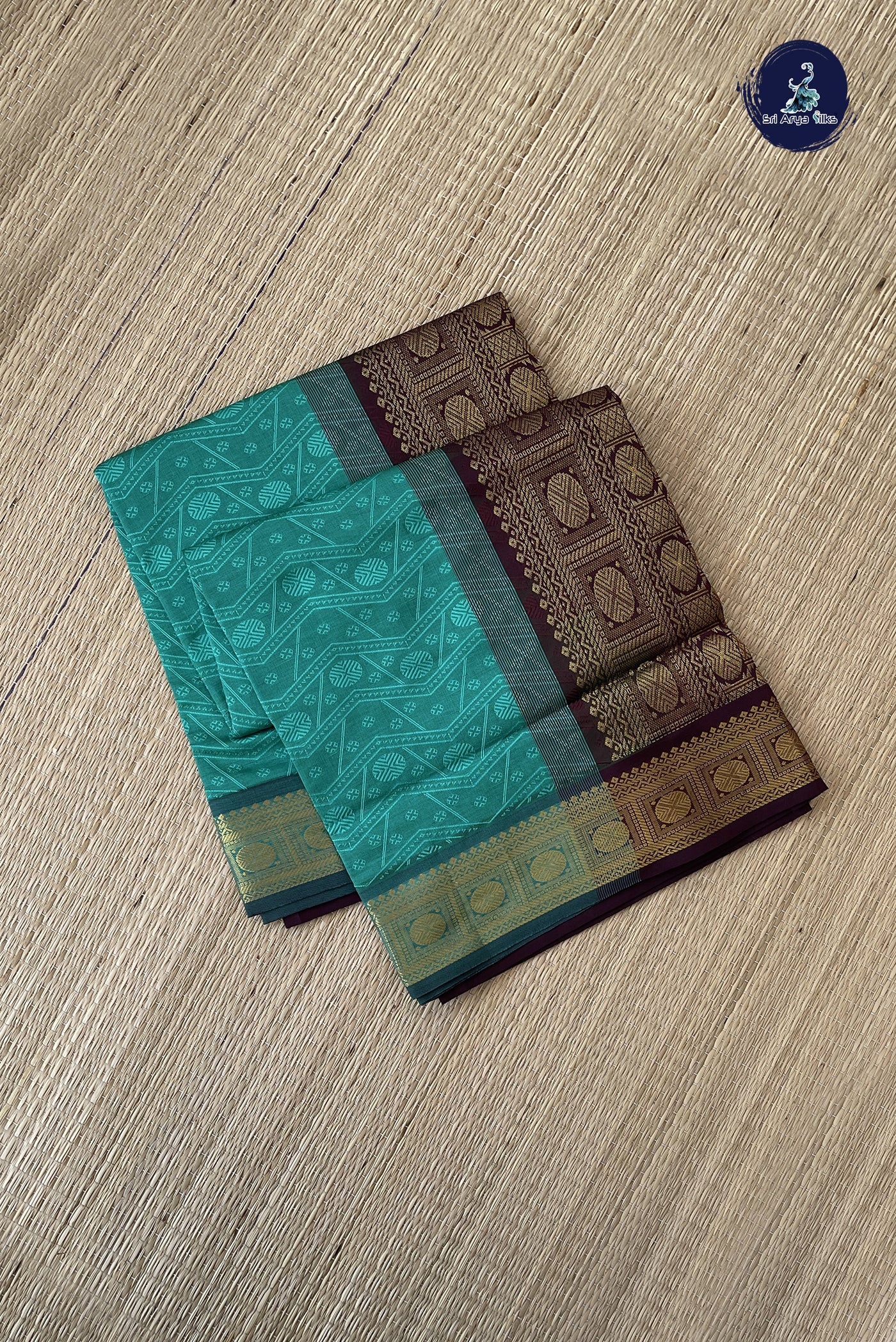 Turquoise Semi Silk Cotton Saree With Embossed Pattern