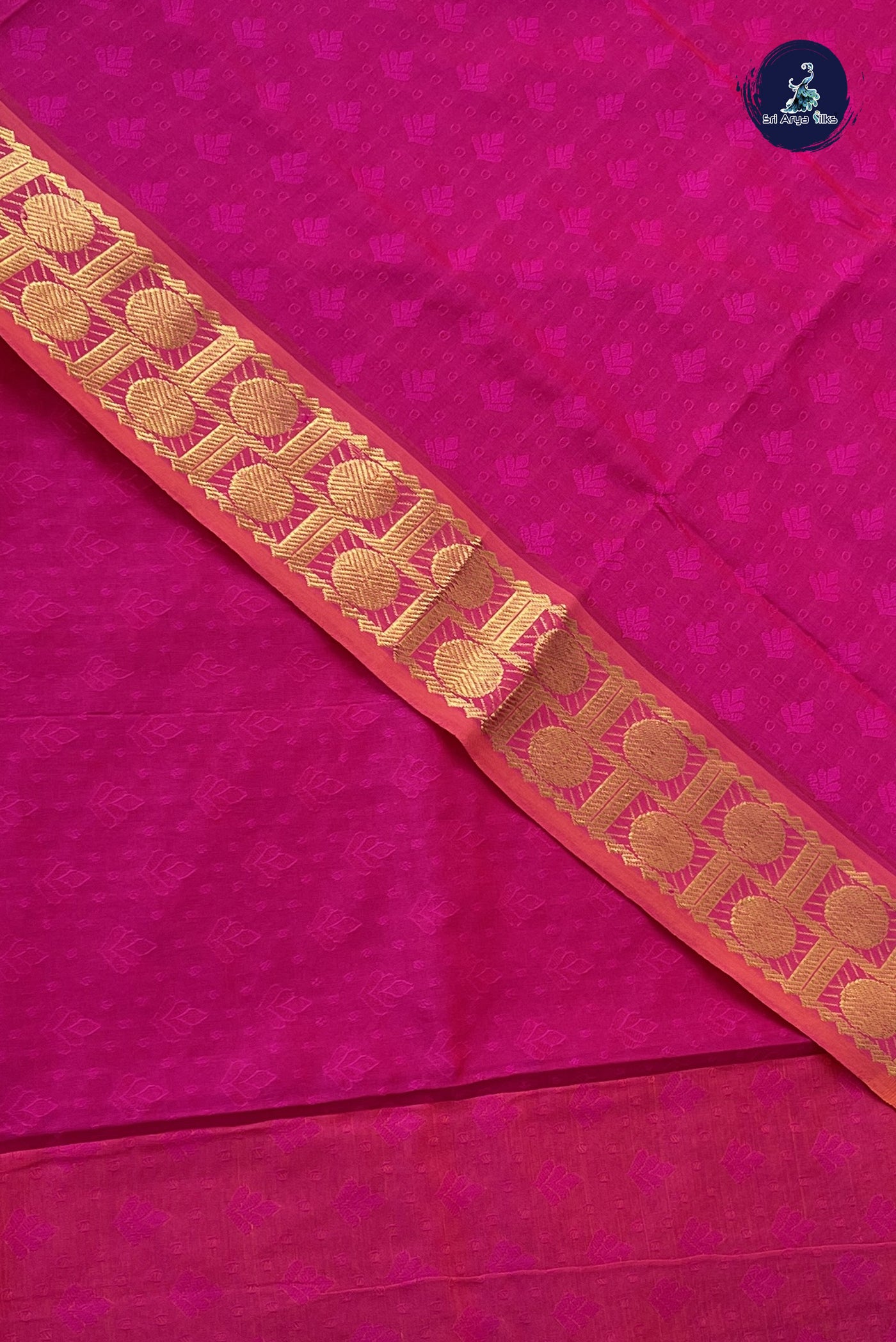 Rani Pink Semi Silk Cotton Saree With Embossed Pattern