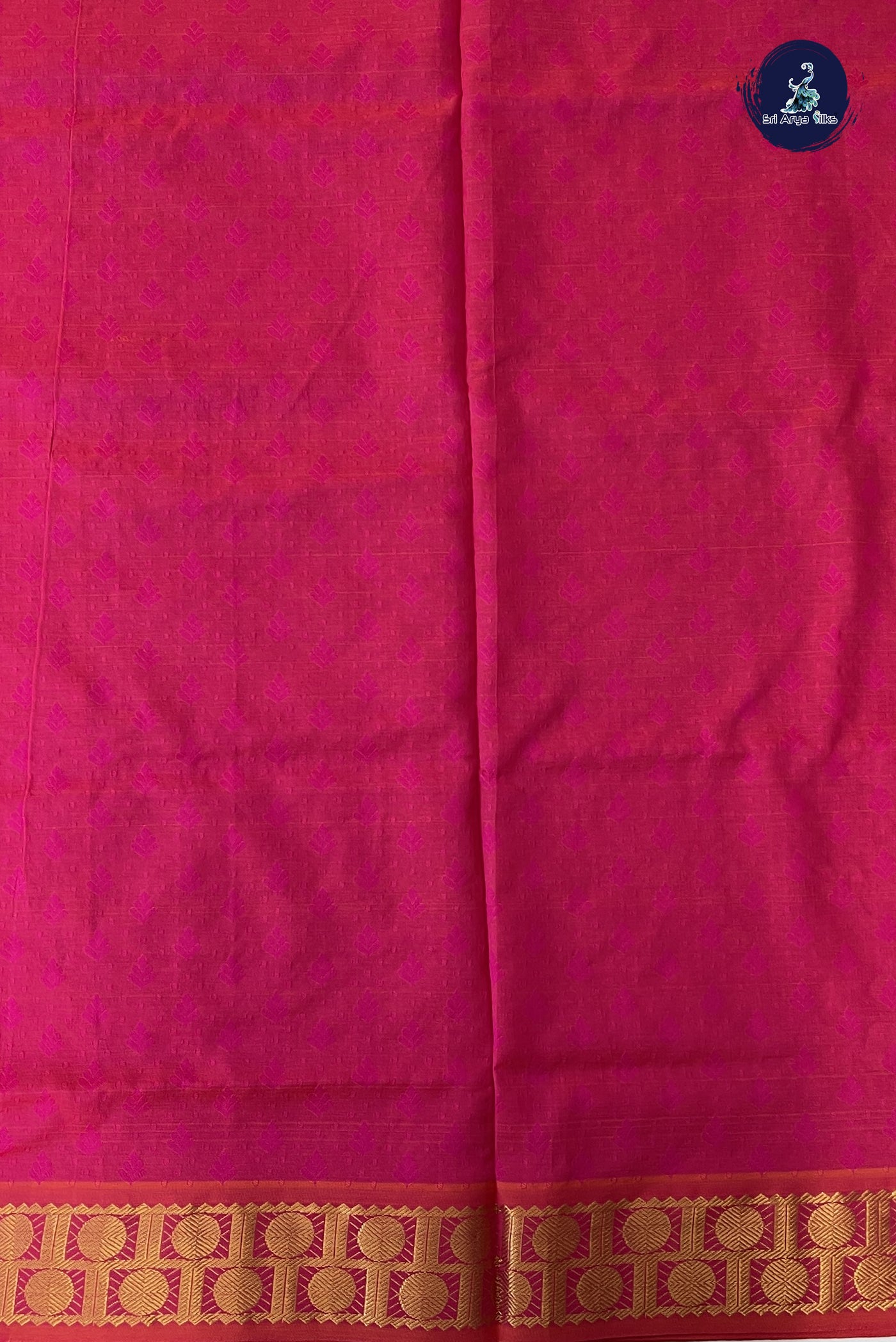 Rani Pink Semi Silk Cotton Saree With Embossed Pattern