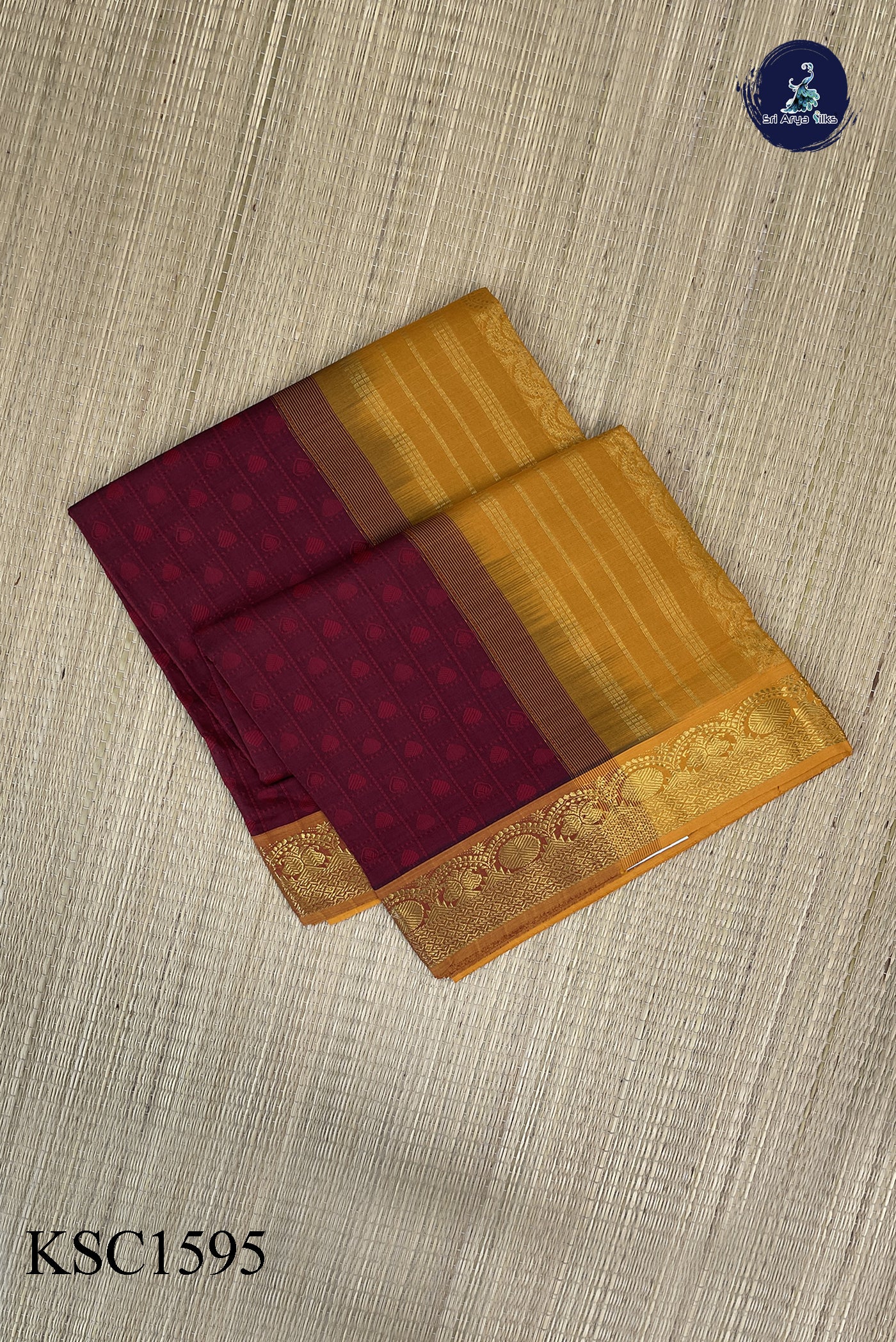 Maroon Semi Silk Cotton Saree With Embossed Pattern