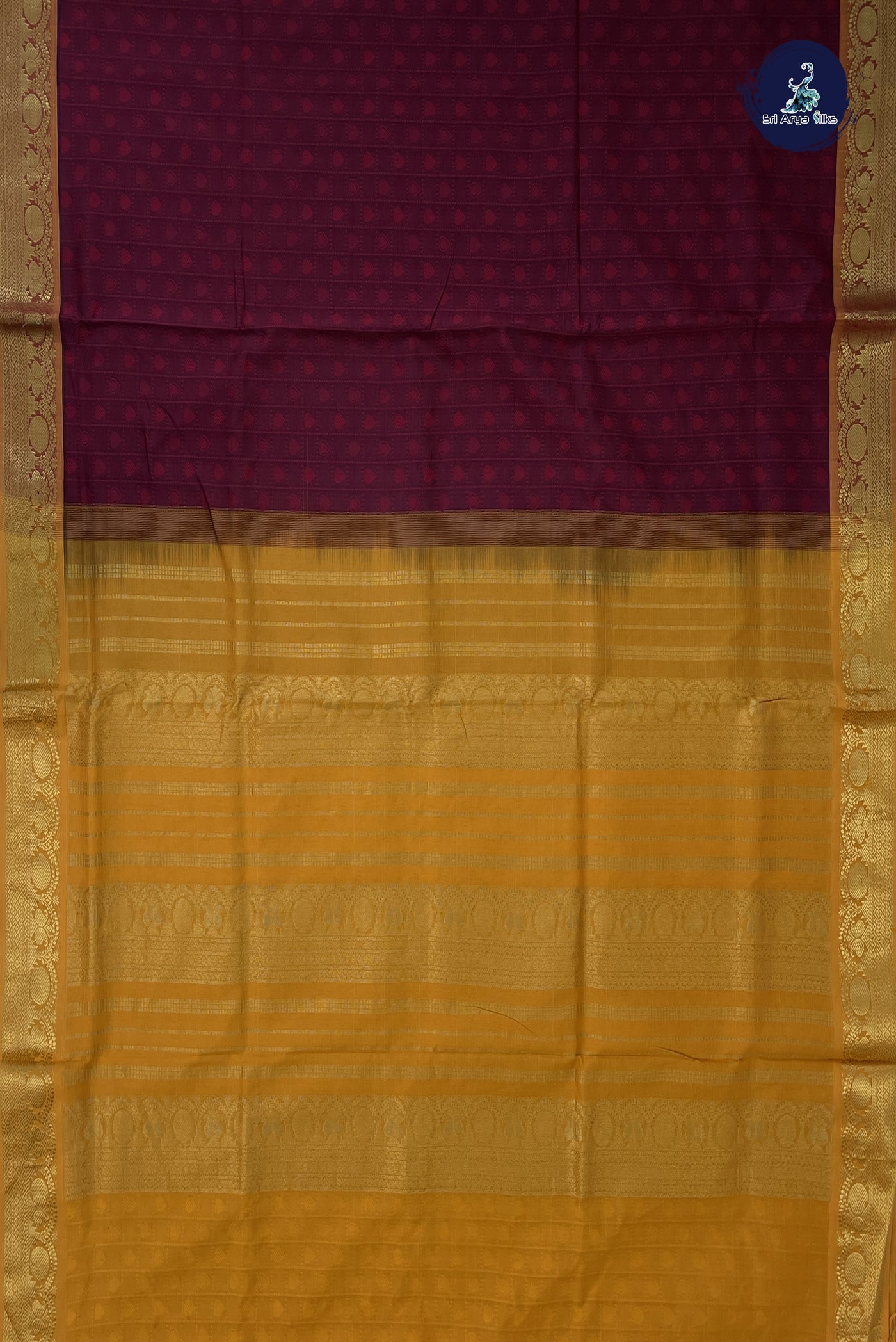 Maroon Semi Silk Cotton Saree With Embossed Pattern