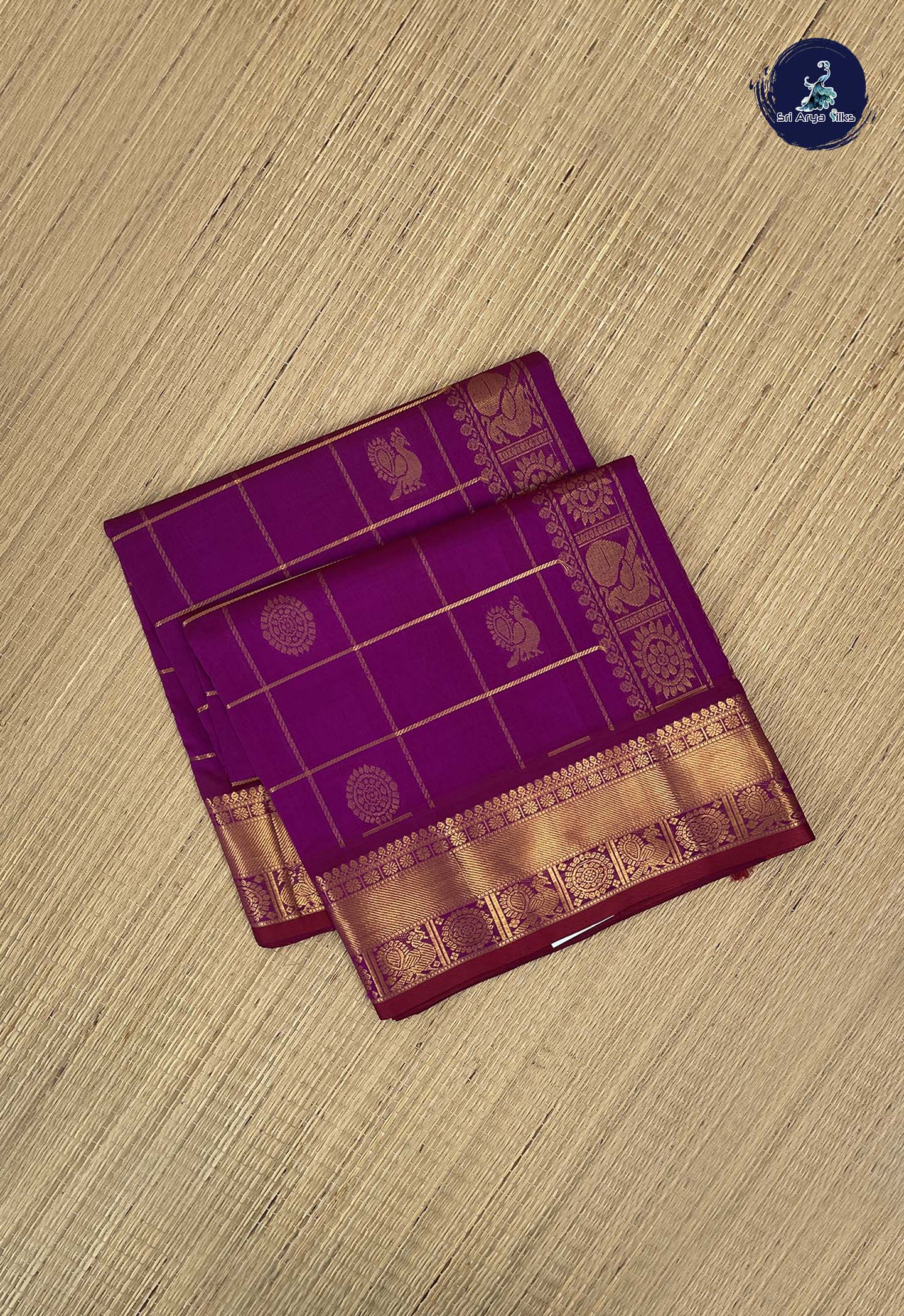 Purple Checked Saree With Mayil Chakram Butta Pattern