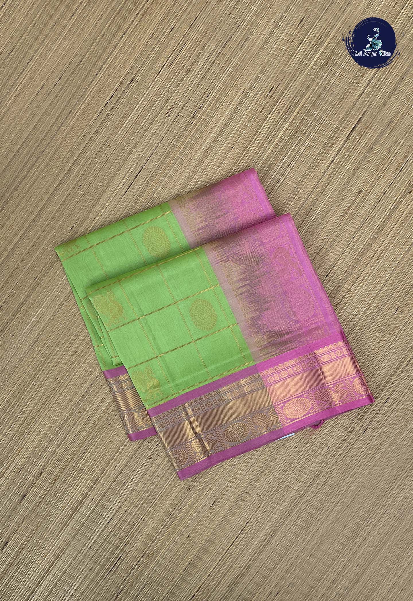 Light Green Checked Saree With Mayil Chakram Butta Pattern