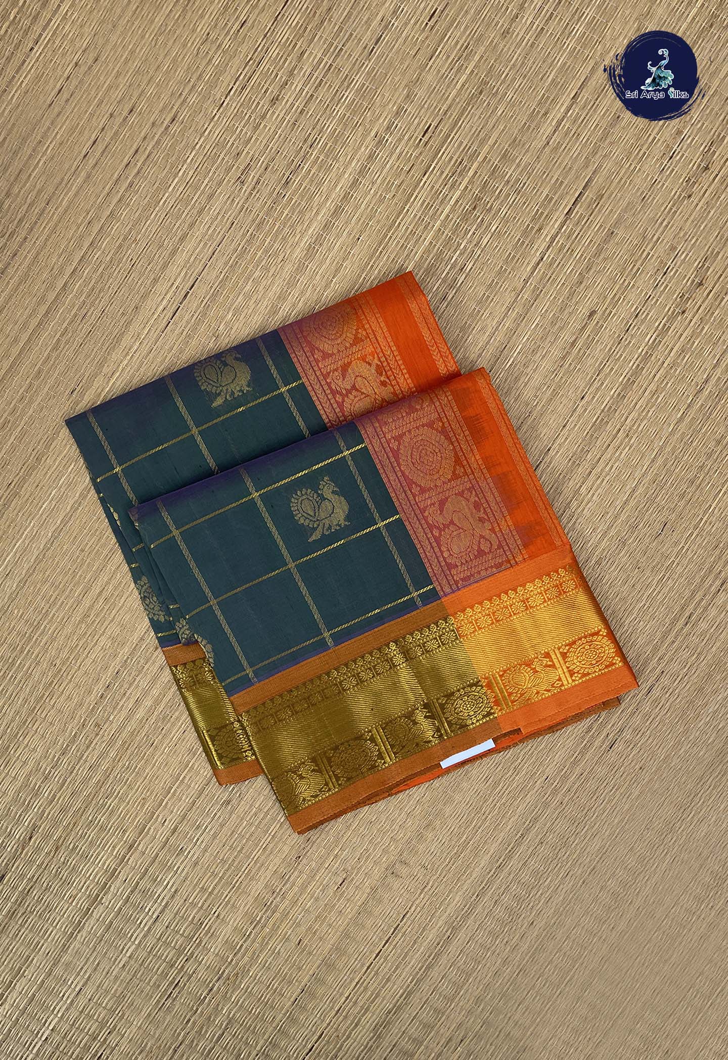 Greenish Blue Checked Saree With Mayil Chakram Butta Pattern