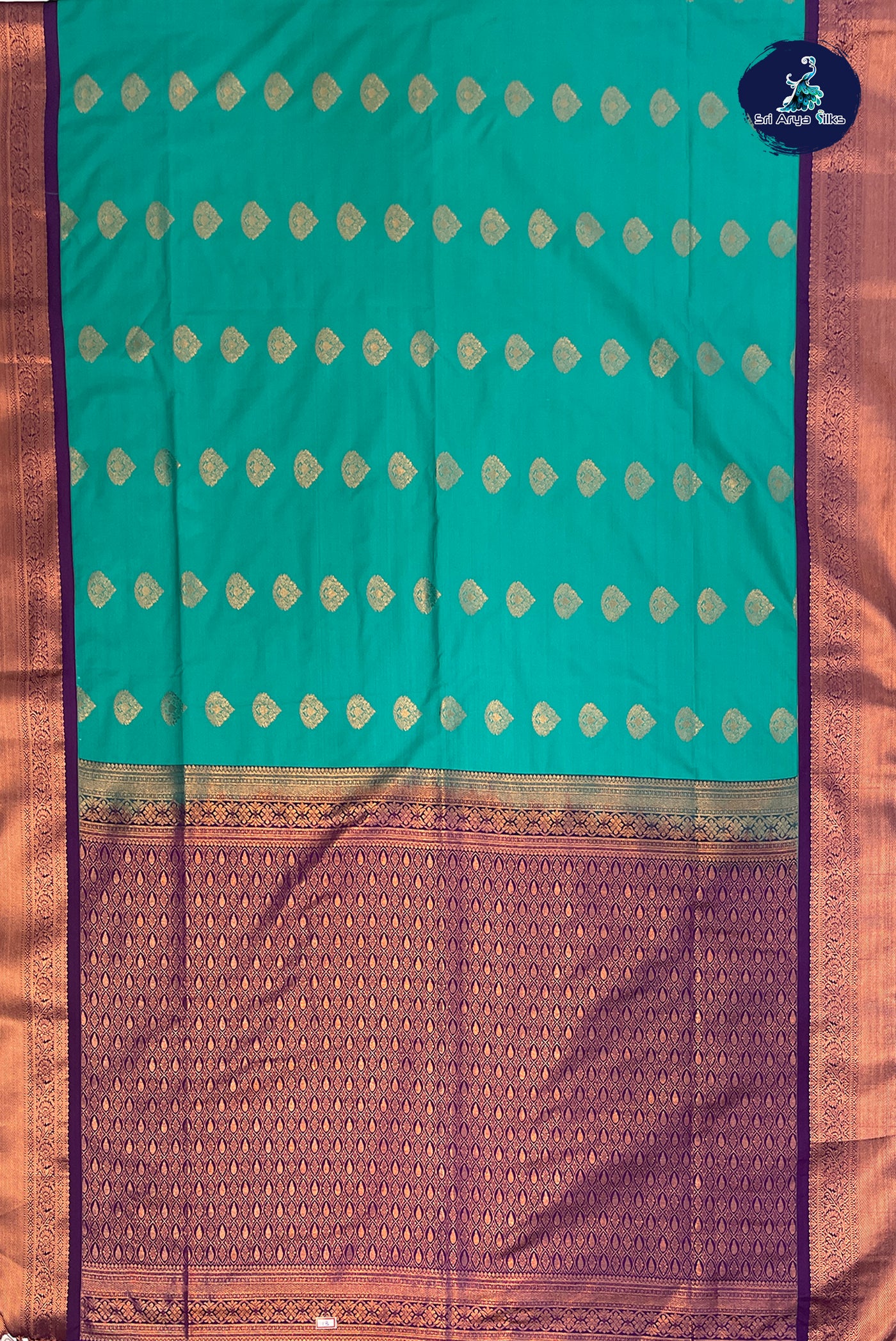 Sea Green Semi Silk Saree With Copper Zari Buttas Pattern