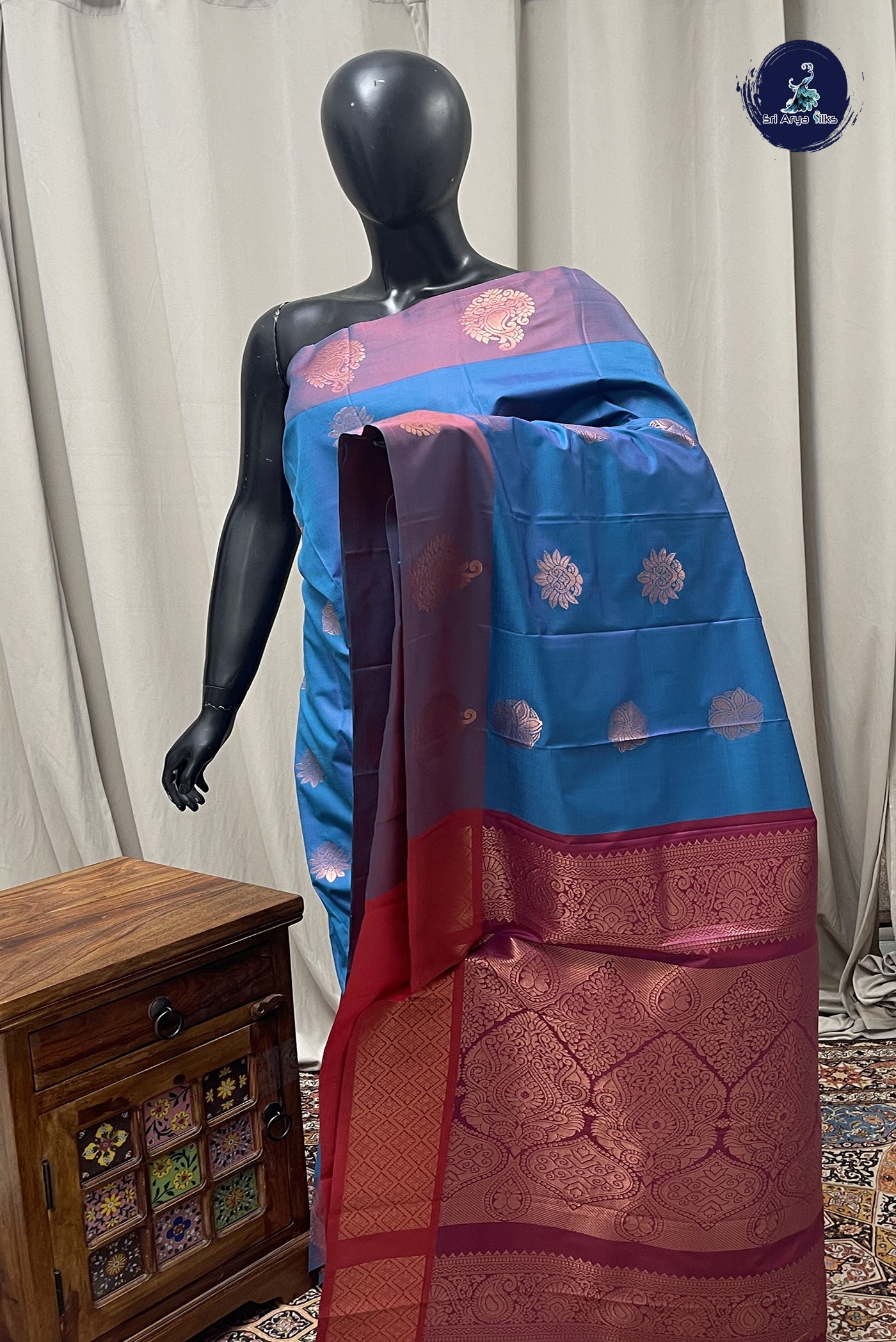 Peacock Blue Semi Soft Silk Saree With Zari Buttas Pattern