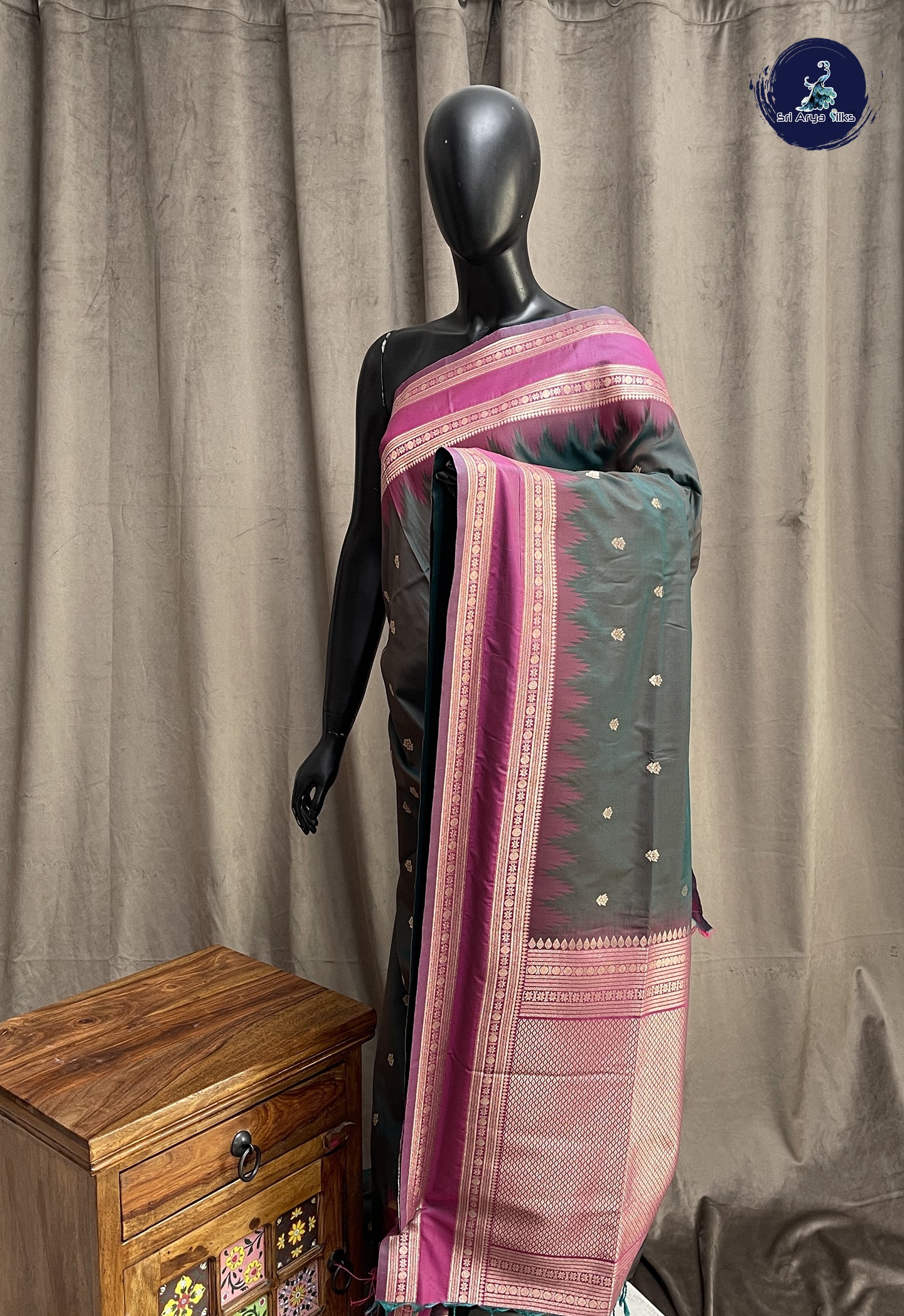 Bluish Green Semi Soft Silk Saree With Zari Buttas Pattern