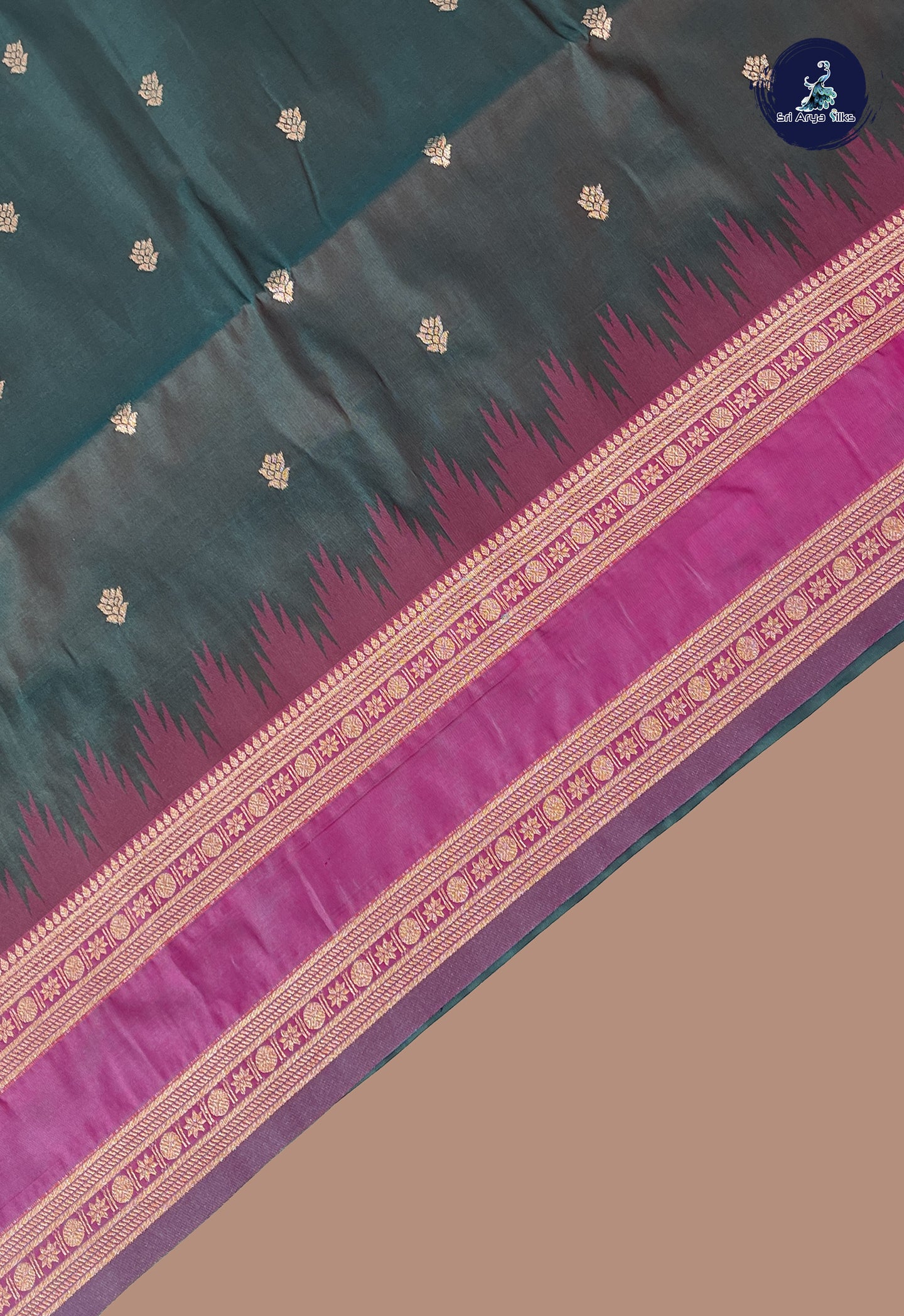 Bluish Green Semi Soft Silk Saree With Zari Buttas Pattern