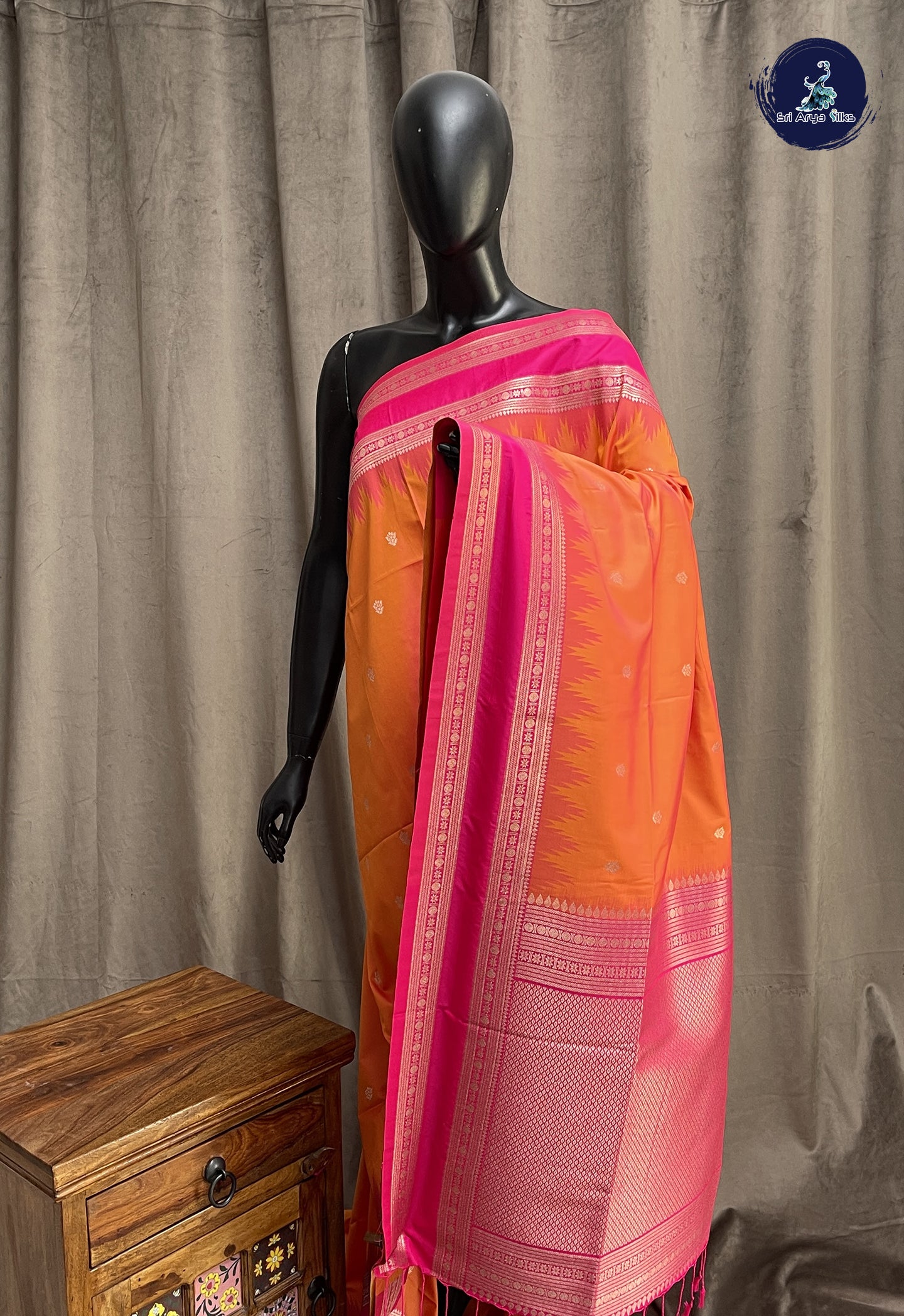 Pinkish Orange Semi Soft Silk Saree With Zari Buttas Pattern