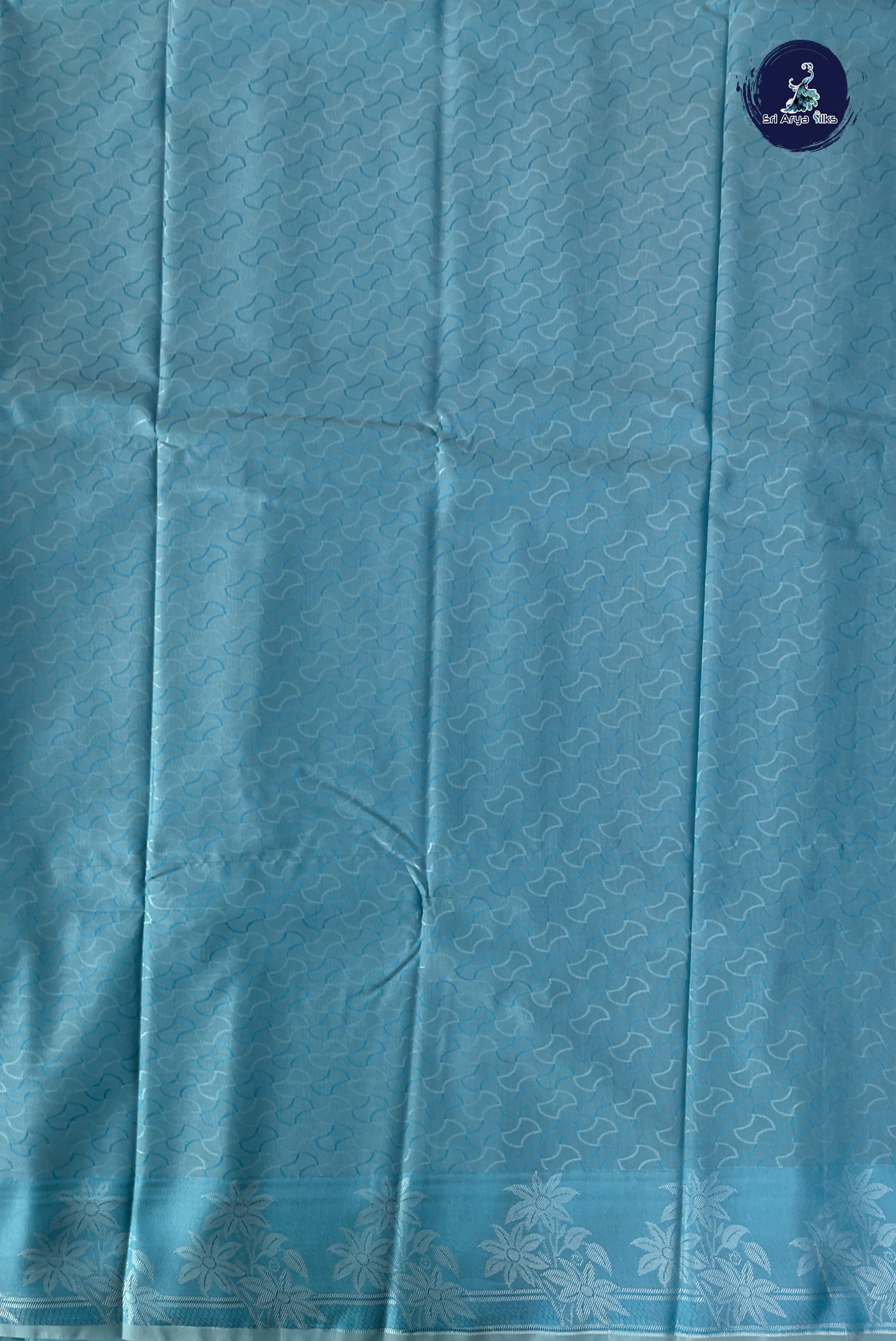Blue Semi Soft Silk Saree With Embossed Pattern