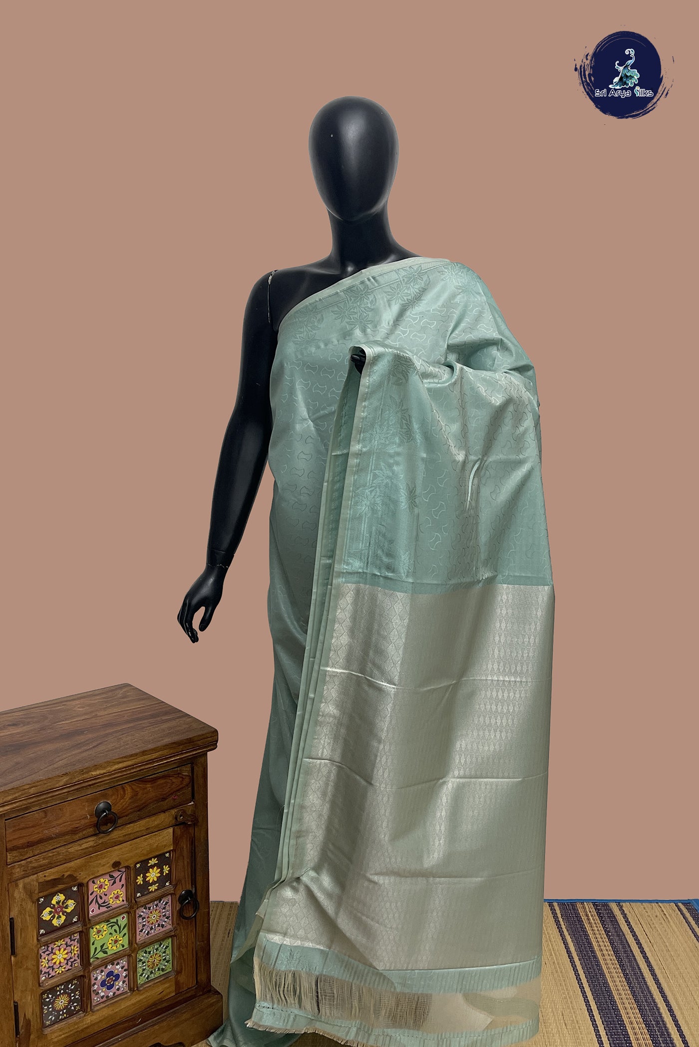 Pastel Shade Semi Soft Silk Saree With Embossed Pattern