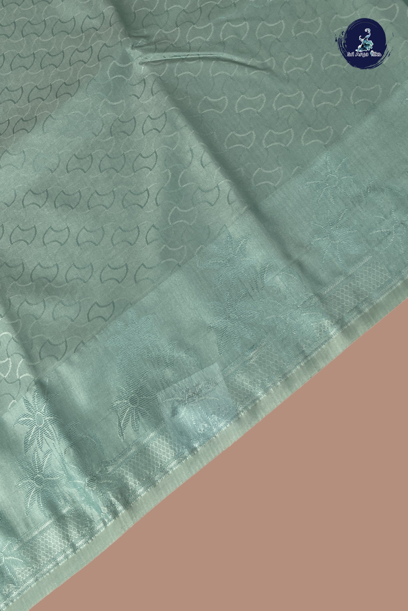 Pastel Shade Semi Soft Silk Saree With Embossed Pattern