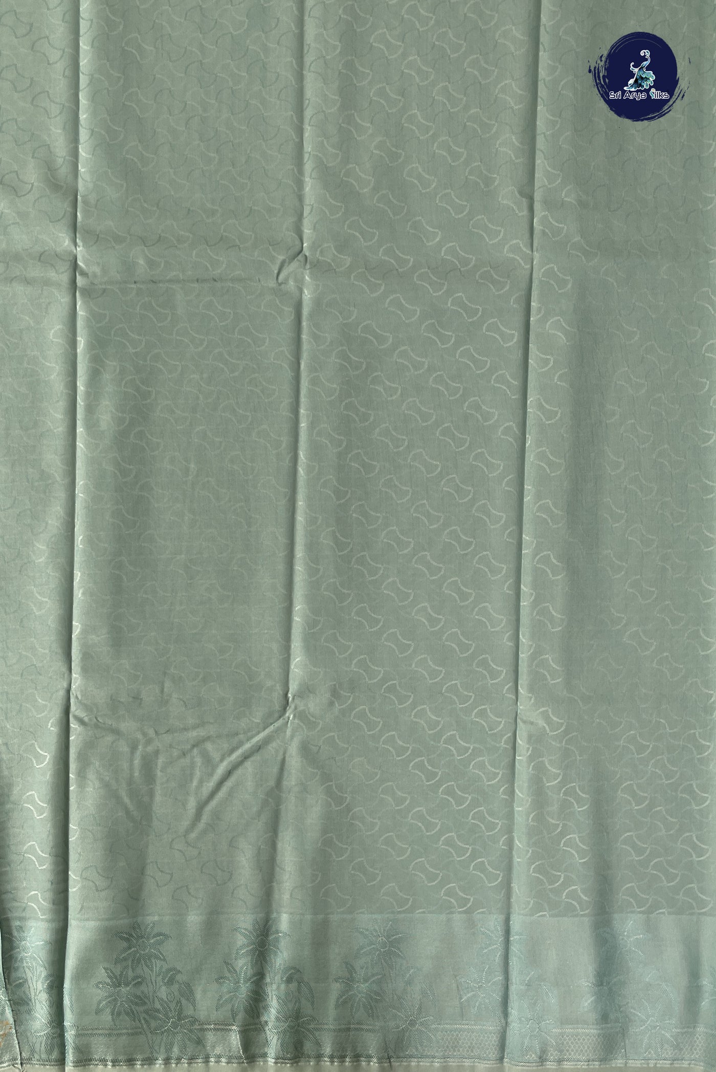 Pastel Shade Semi Soft Silk Saree With Embossed Pattern