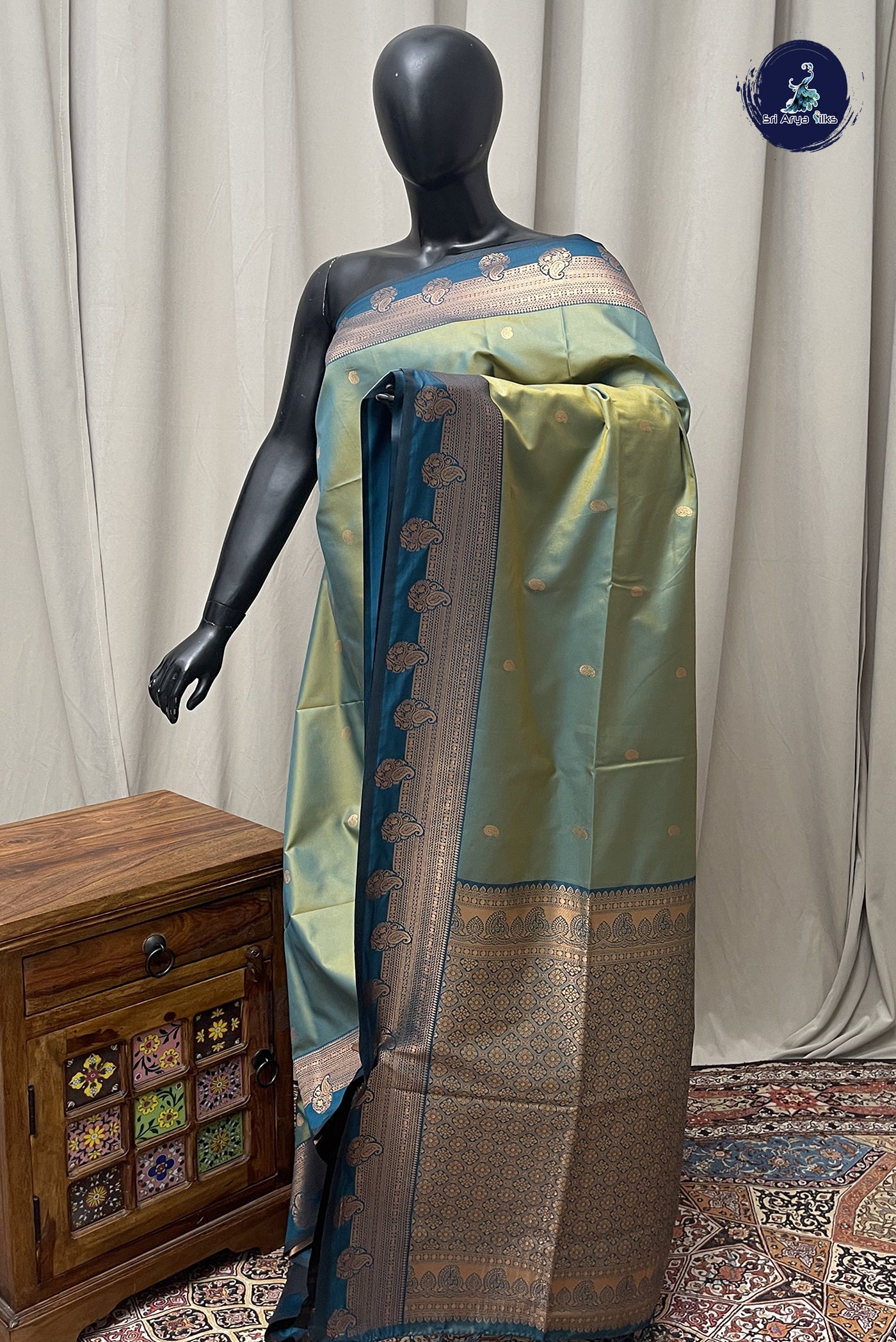 Bluish Green Semi Silk Saree With Zari Buttas Pattern