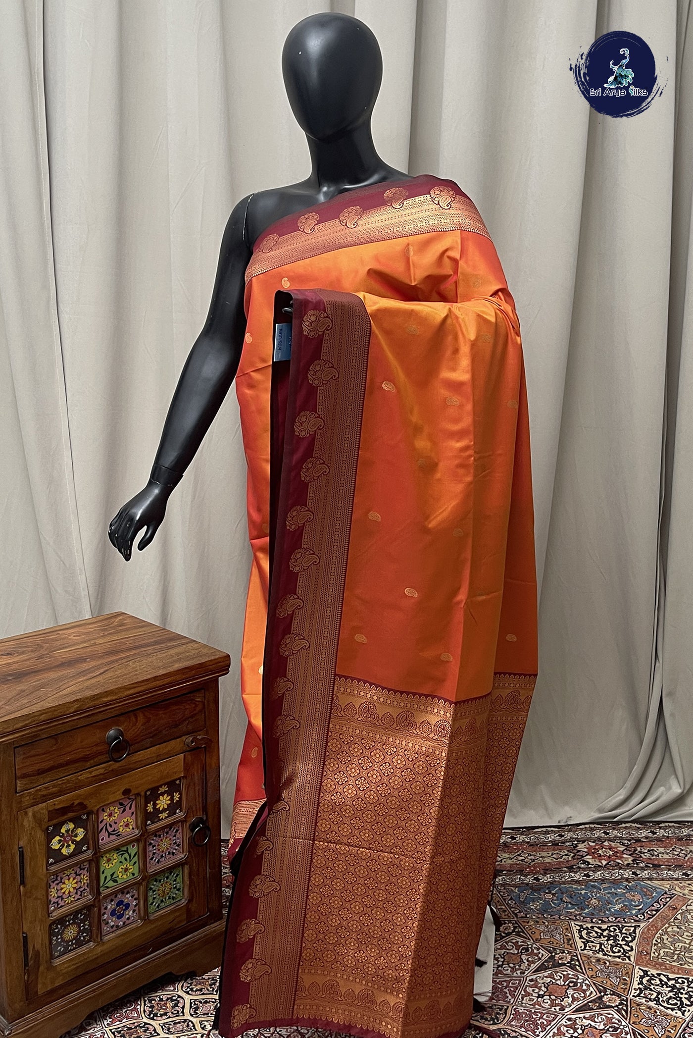 Lite Mustard Orange Semi Silk Saree With Zari Buttas Pattern