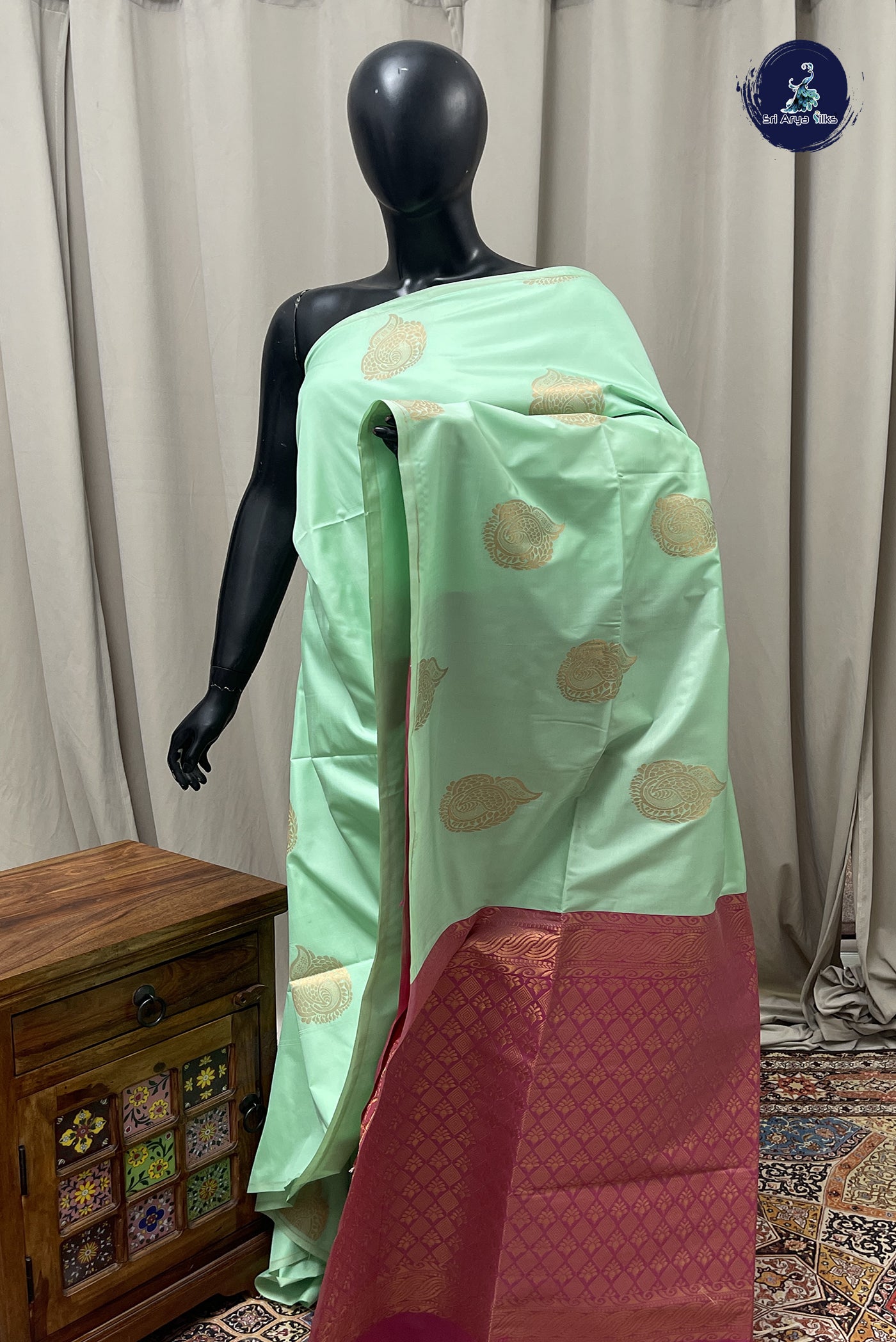 Pastel Green Semi Silk Saree With Zari Buttas Pattern